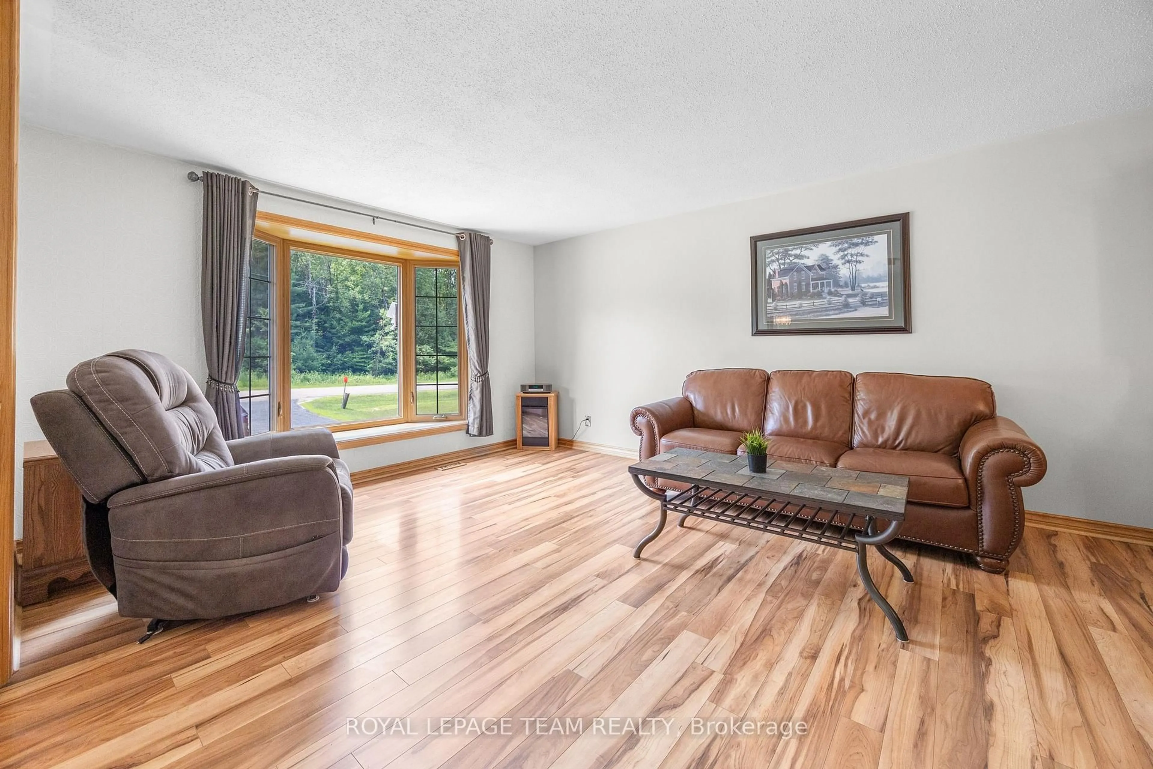 Living room with furniture, wood/laminate floor for 3700 Cedar Grove Rd, Edwardsburgh/Cardinal Ontario K0E 1T1