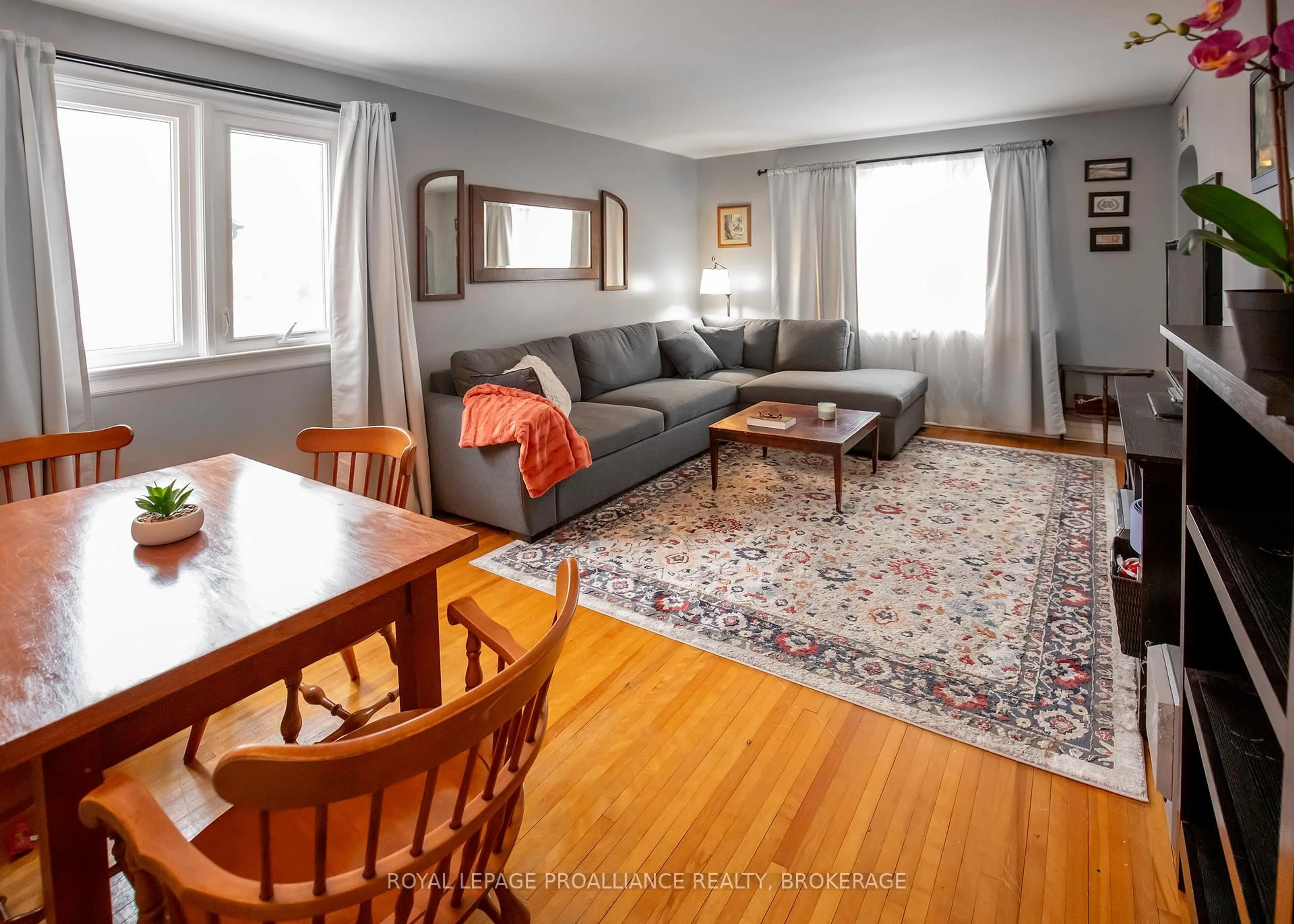 Living room with furniture, wood/laminate floor for 198 Kingscourt Ave, Kingston Ontario K7K 4P8