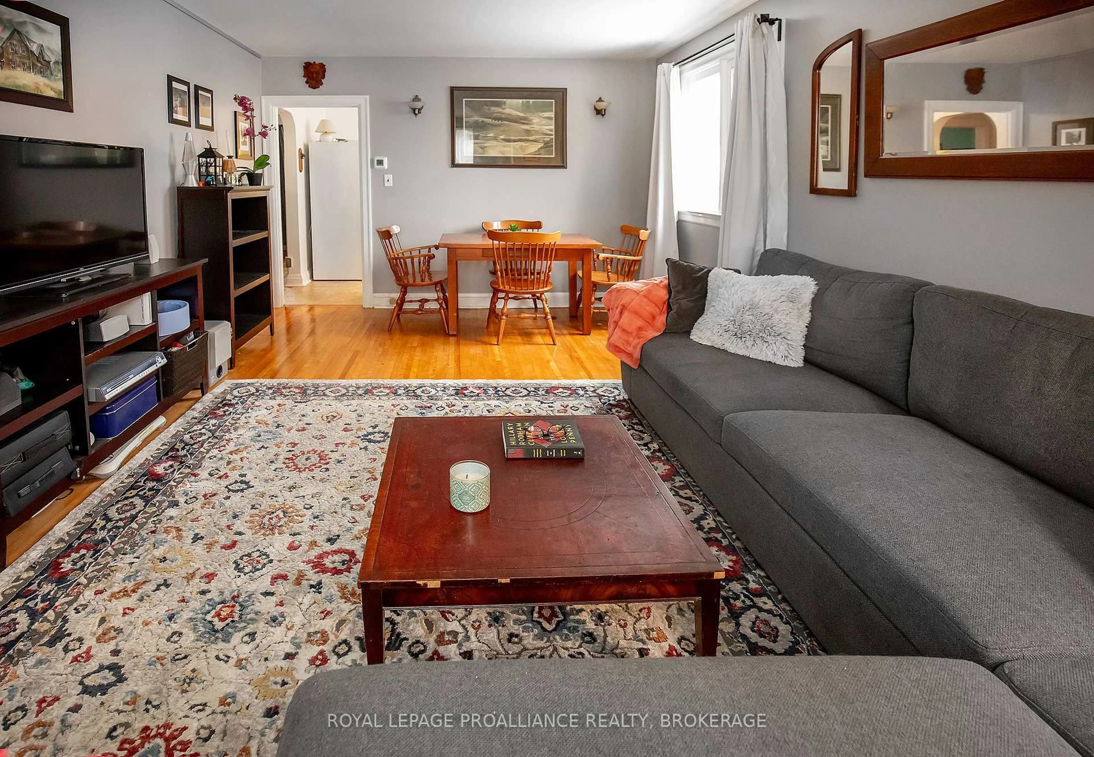 Living room with furniture, wood/laminate floor for 198 Kingscourt Ave, Kingston Ontario K7K 4P8