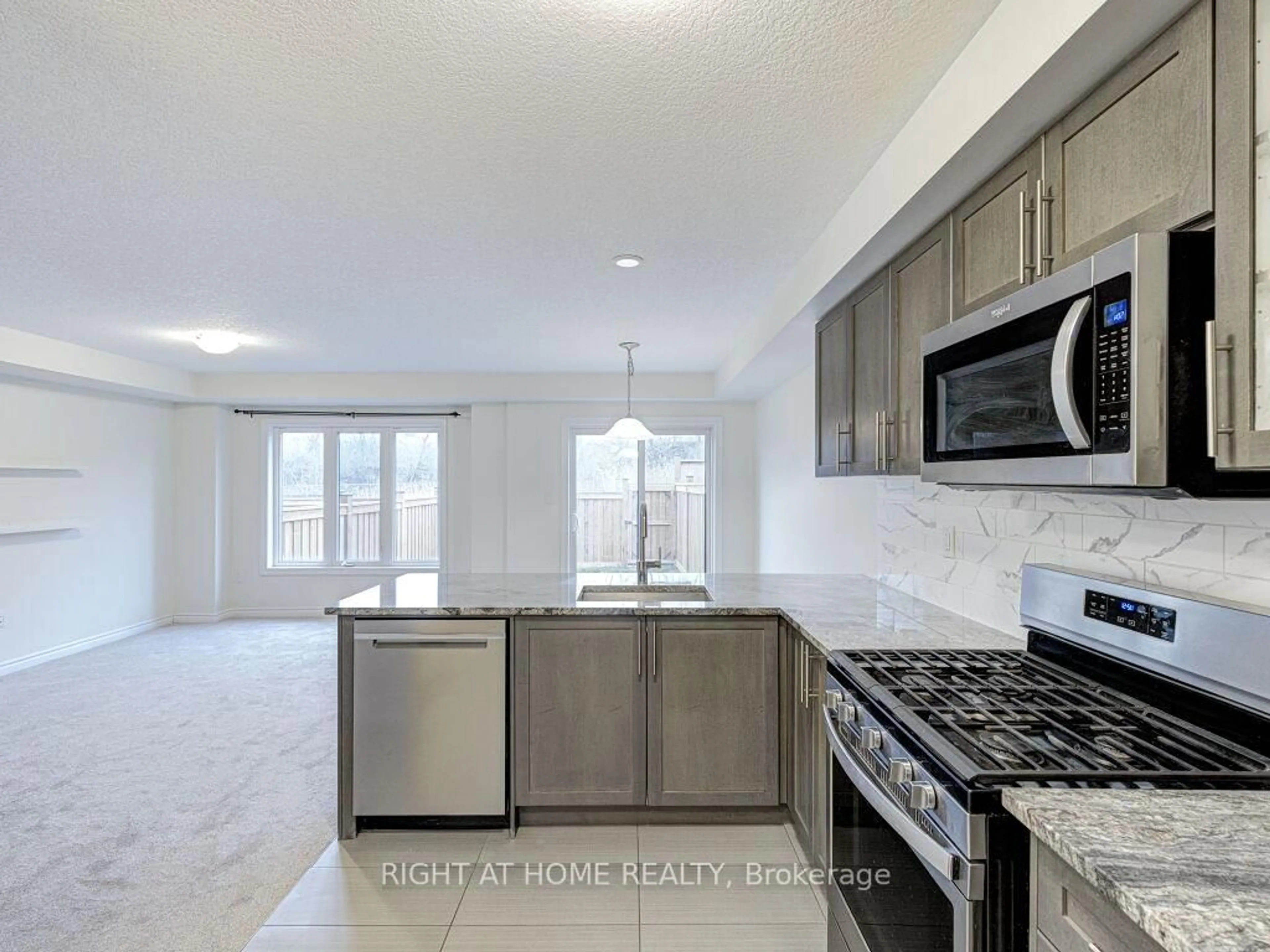 Open concept kitchen, ceramic/tile floor for 121 Scarletwood St, Hamilton Ontario L8J 0K8