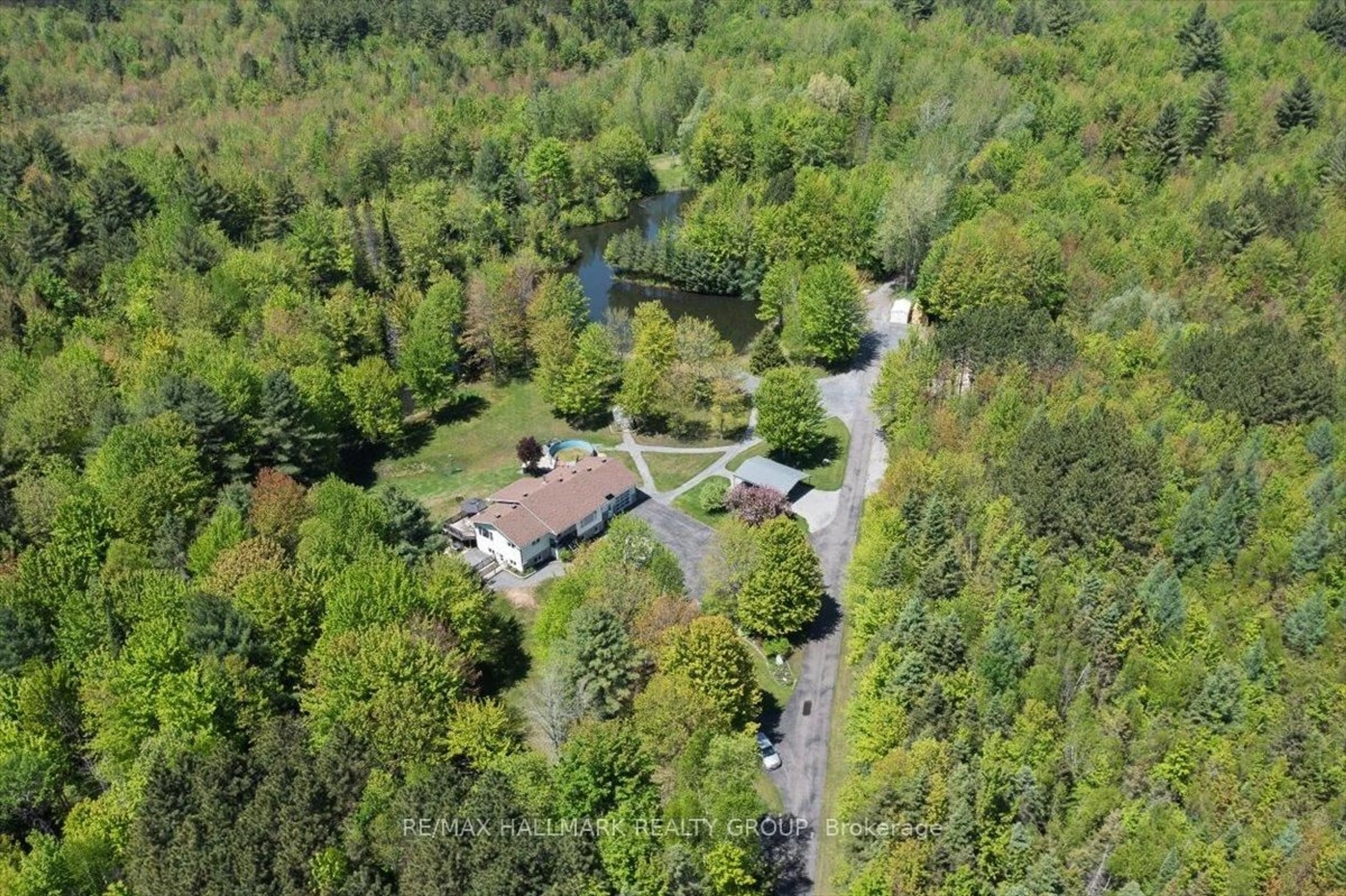 A pic from outside/outdoor area/front of a property/back of a property/a pic from drone, forest/trees view for 1720 Des Pins Rd, The Nation Ontario K0A 2M0