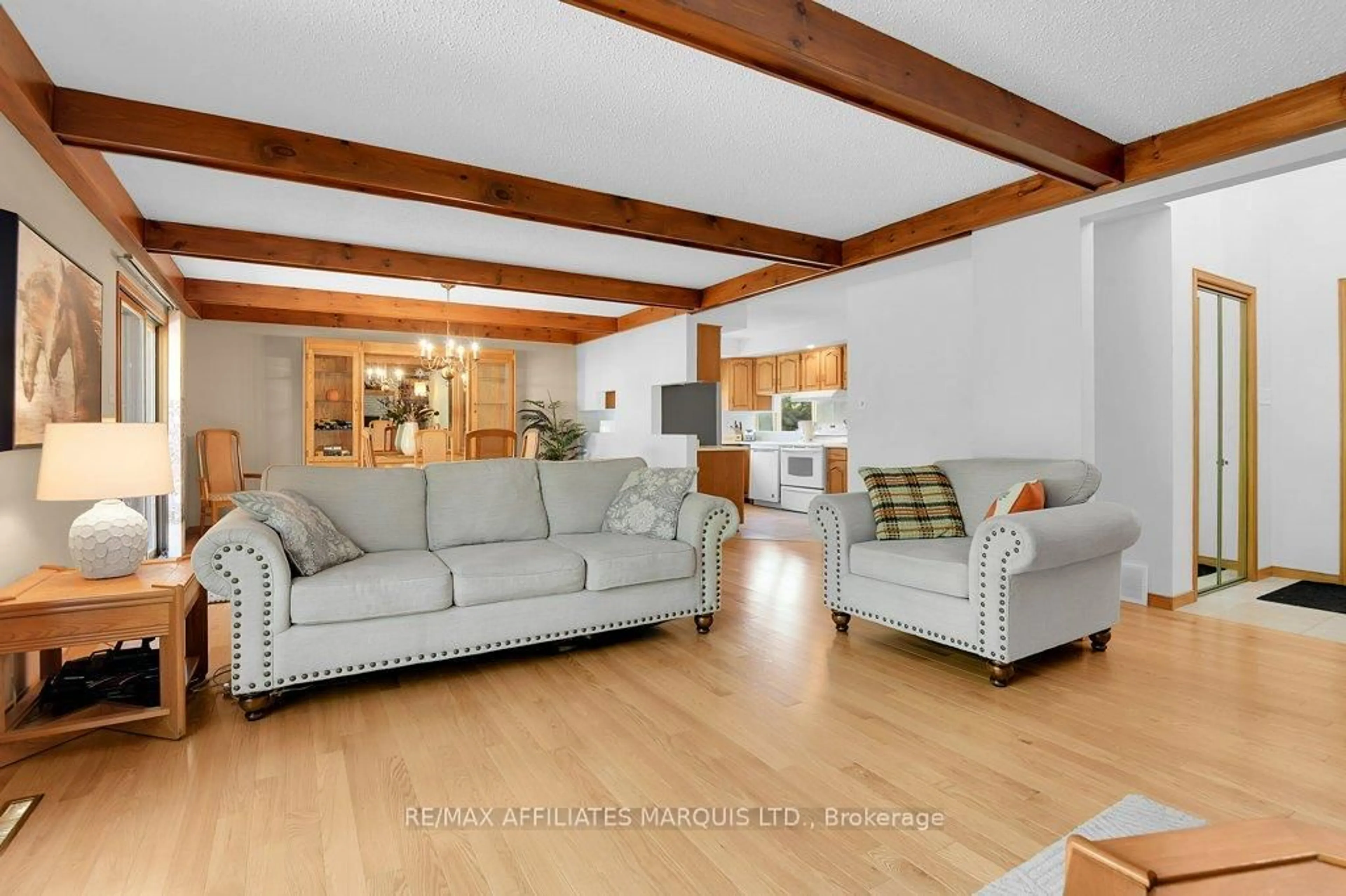 Living room with furniture, wood/laminate floor for 6711 Gilmore Hill Rd, South Glengarry Ontario K6H 7J3