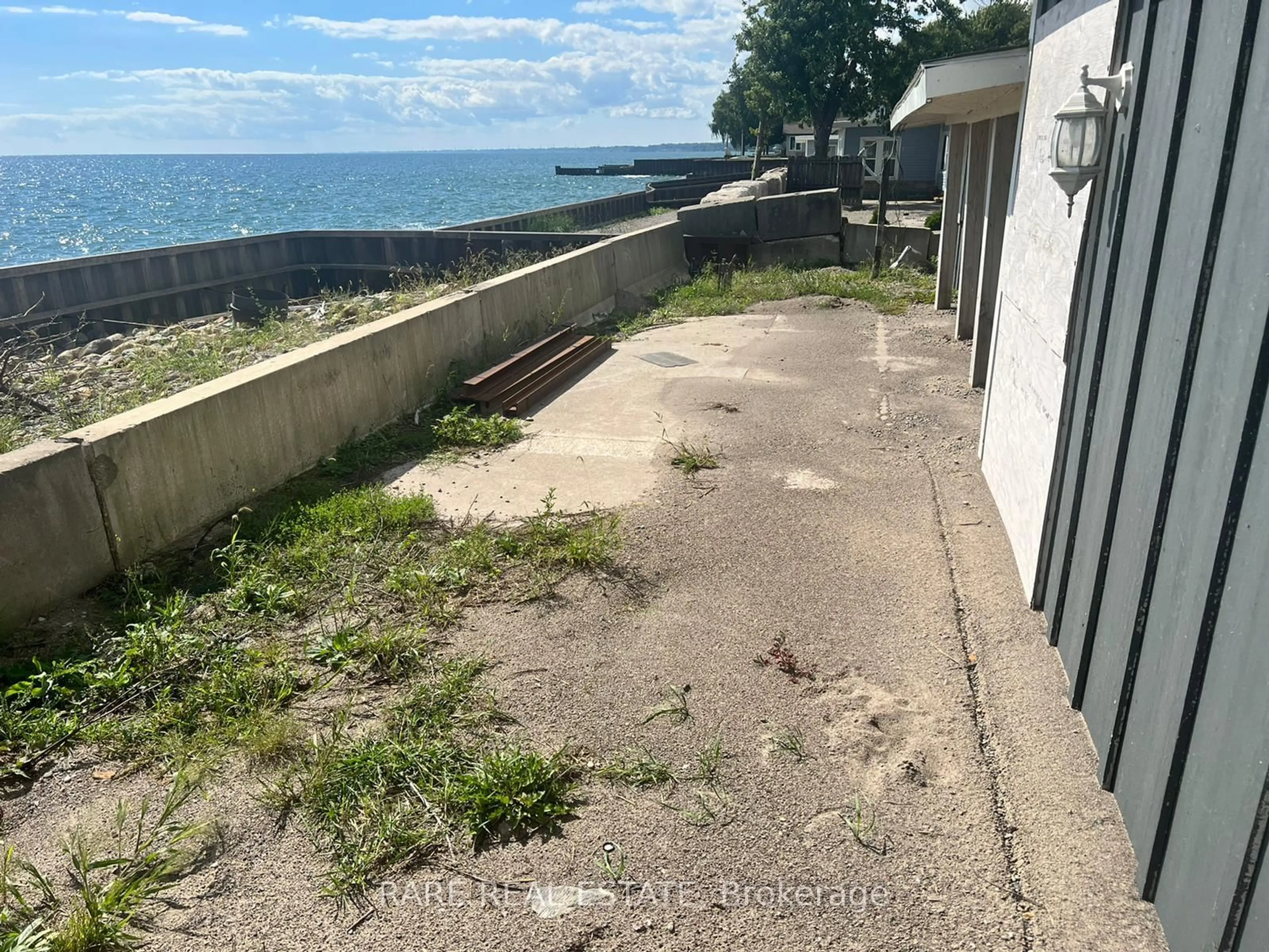 A pic from outside/outdoor area/front of a property/back of a property/a pic from drone, water/lake/river/ocean view for 18080 Erie Shore Dr, Chatham-Kent Ontario N0P 1A0