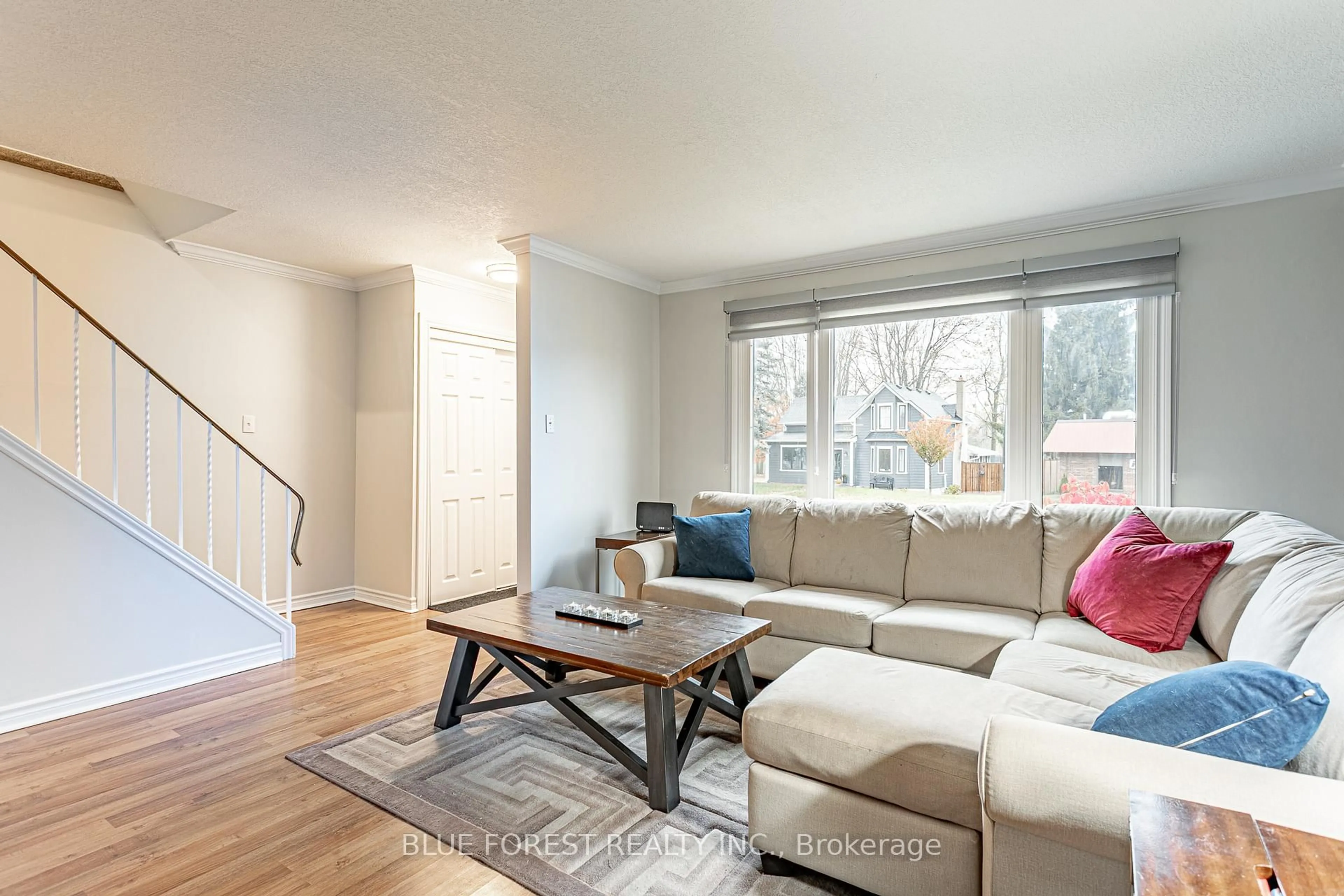 Living room with furniture, wood/laminate floor for 4167 Hamilton Rd, Thames Centre Ontario N0L 1G2