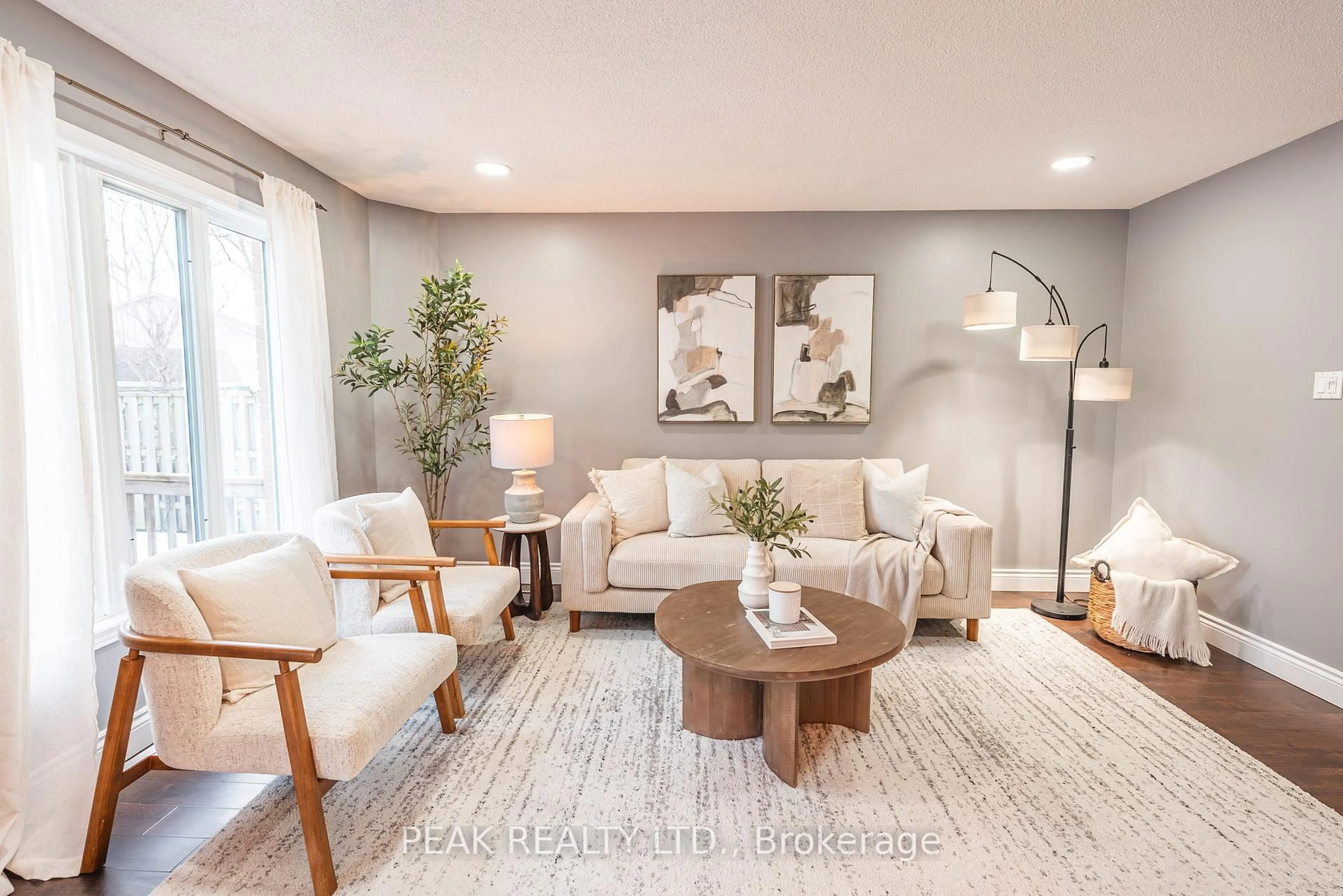 Living room with furniture, wood/laminate floor for 42 Roman Cres, London East Ontario N5V 4W4