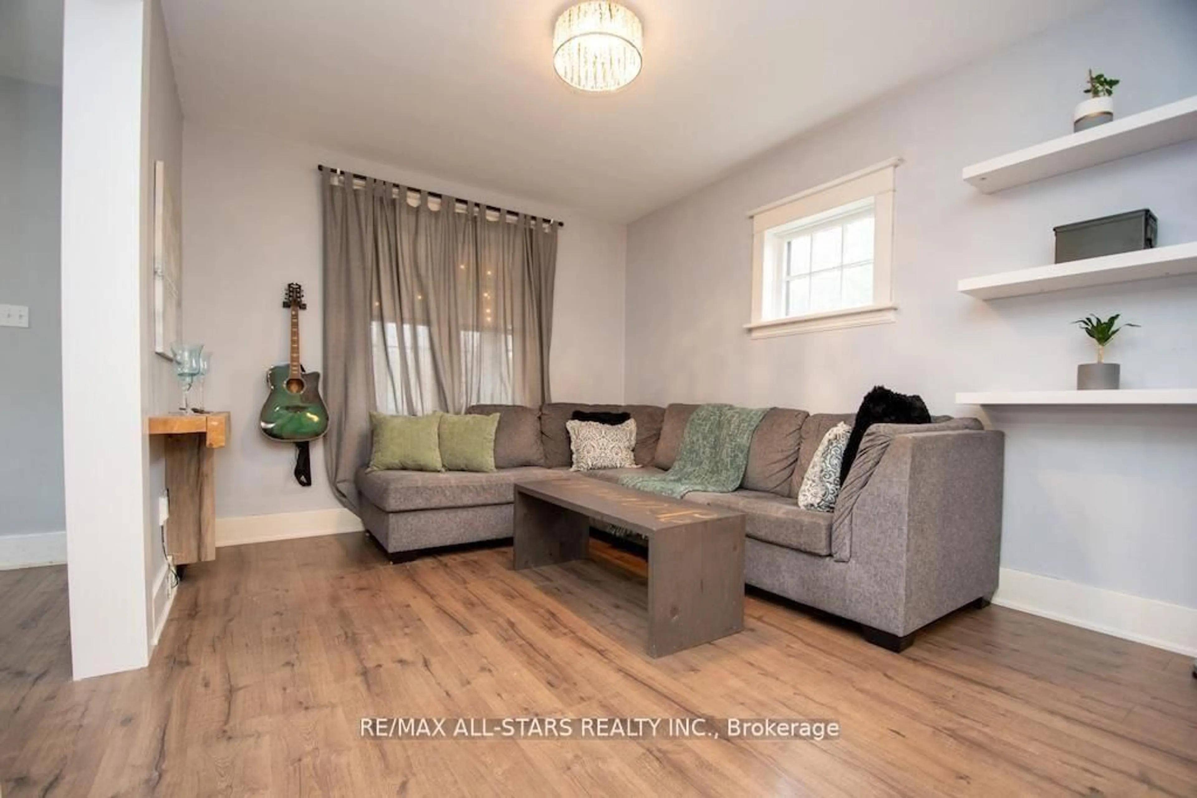 Living room with furniture, wood/laminate floor for 2 St. Patrick St, Kawartha Lakes Ontario K9V 1R1