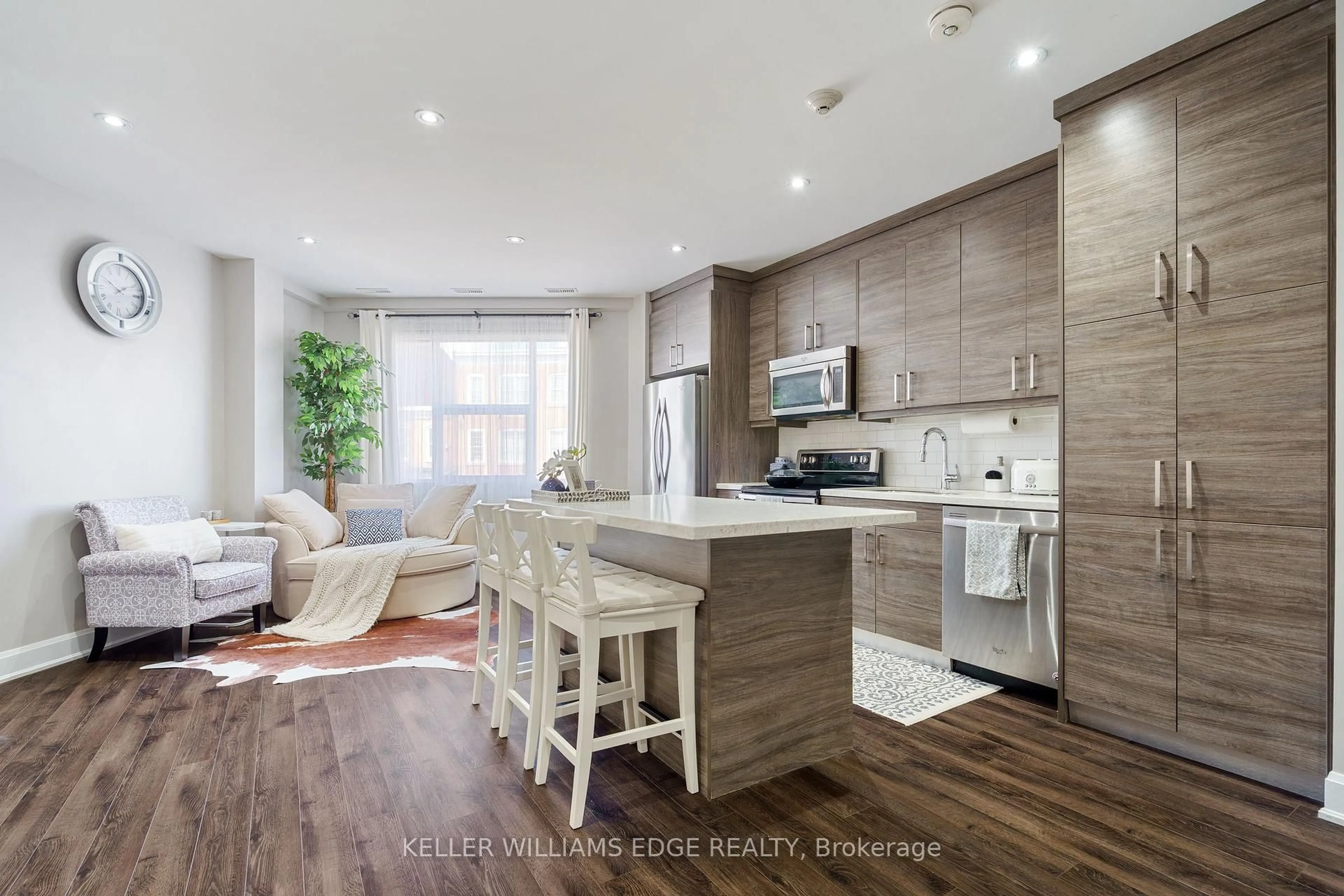 Open concept kitchen, wood/laminate floor for 2 King St #208, Hamilton Ontario L9H 6Z1