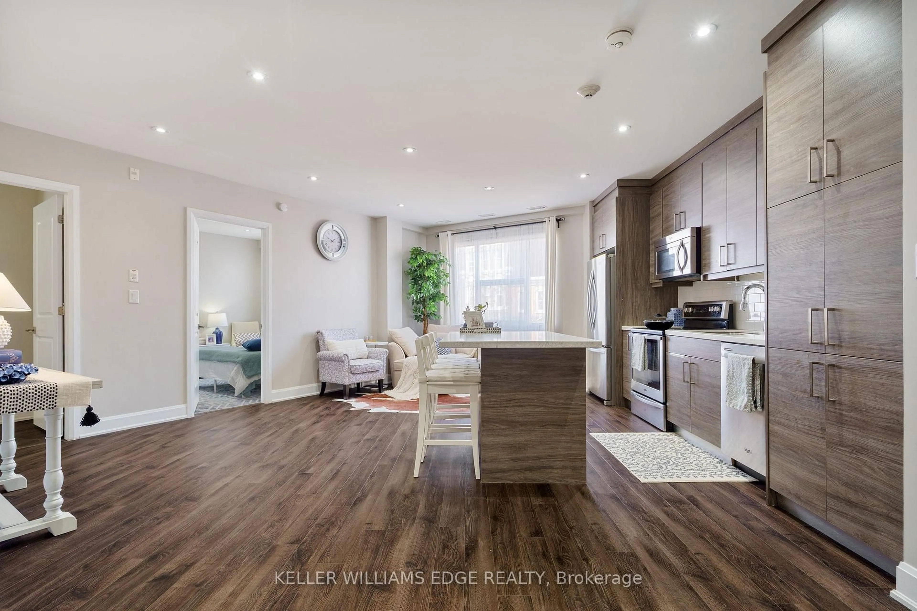 Open concept kitchen, wood/laminate floor for 2 King St #208, Hamilton Ontario L9H 6Z1