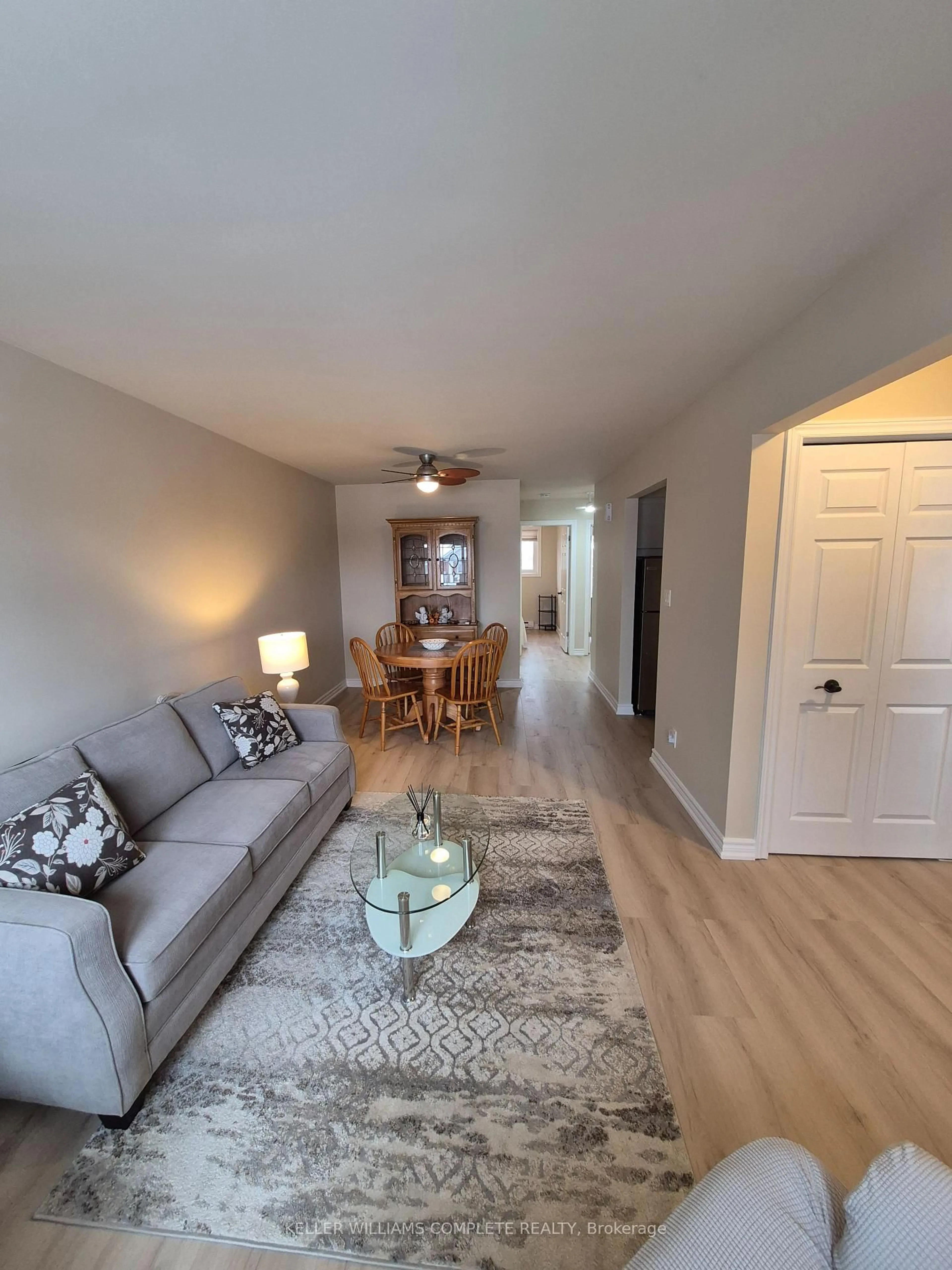 Living room with furniture, wood/laminate floor for 226 VANSICKLE Rd #4, St. Catharines Ontario L2S 2S7