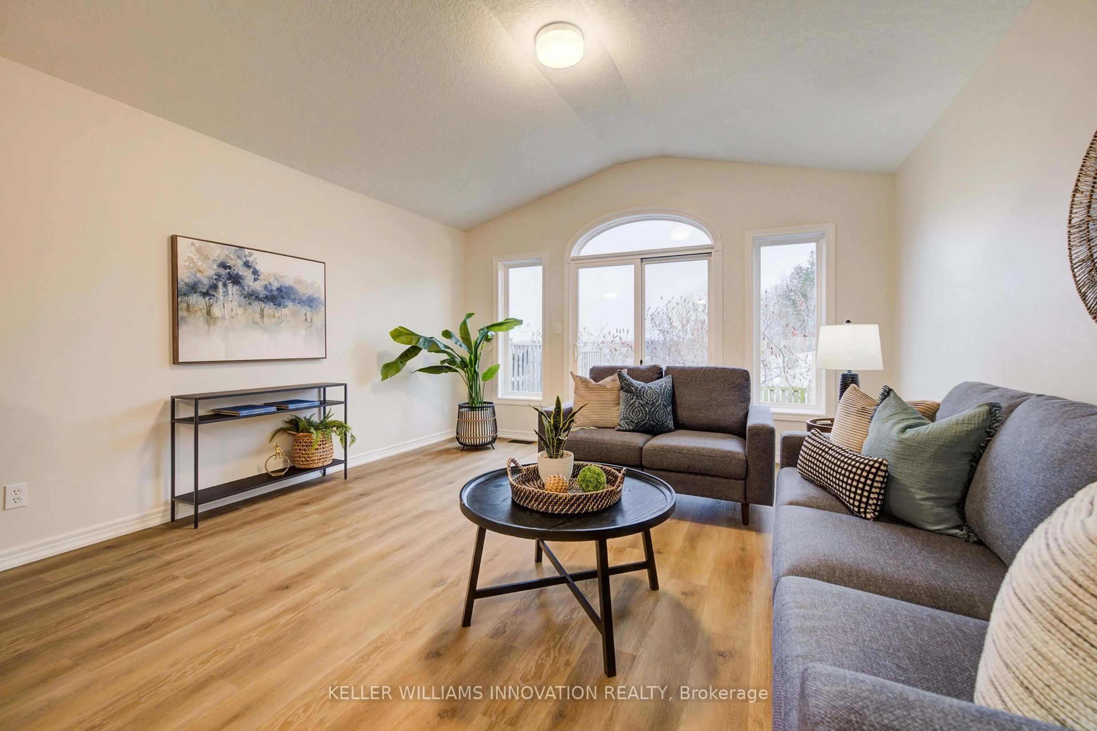 Living room with furniture, wood/laminate floor for 98 Colton Circ, Kitchener Ontario N2A 4K4