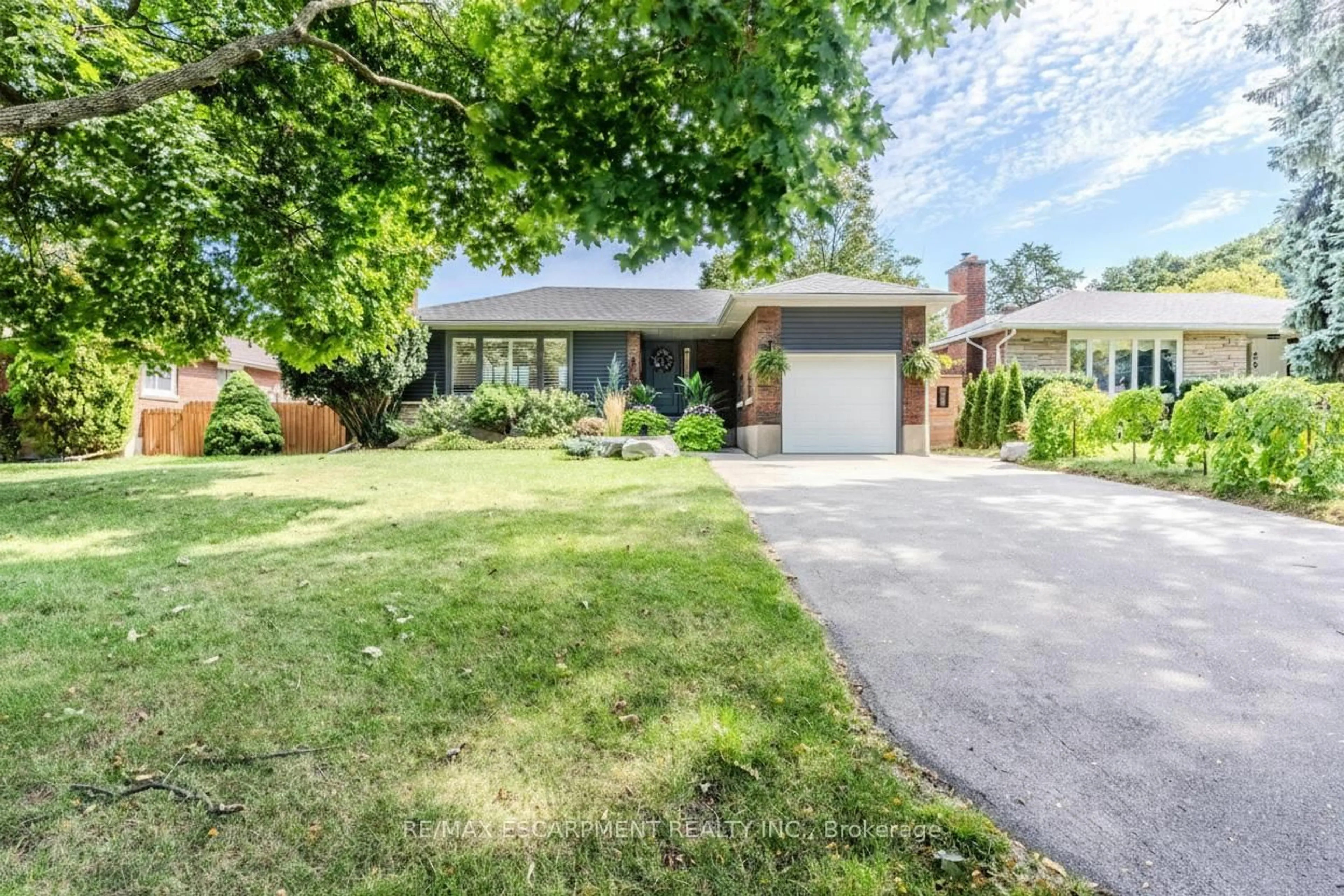 Home with brick exterior material, street for 23 West Hampton Rd, St. Catharines Ontario L2T 3E6