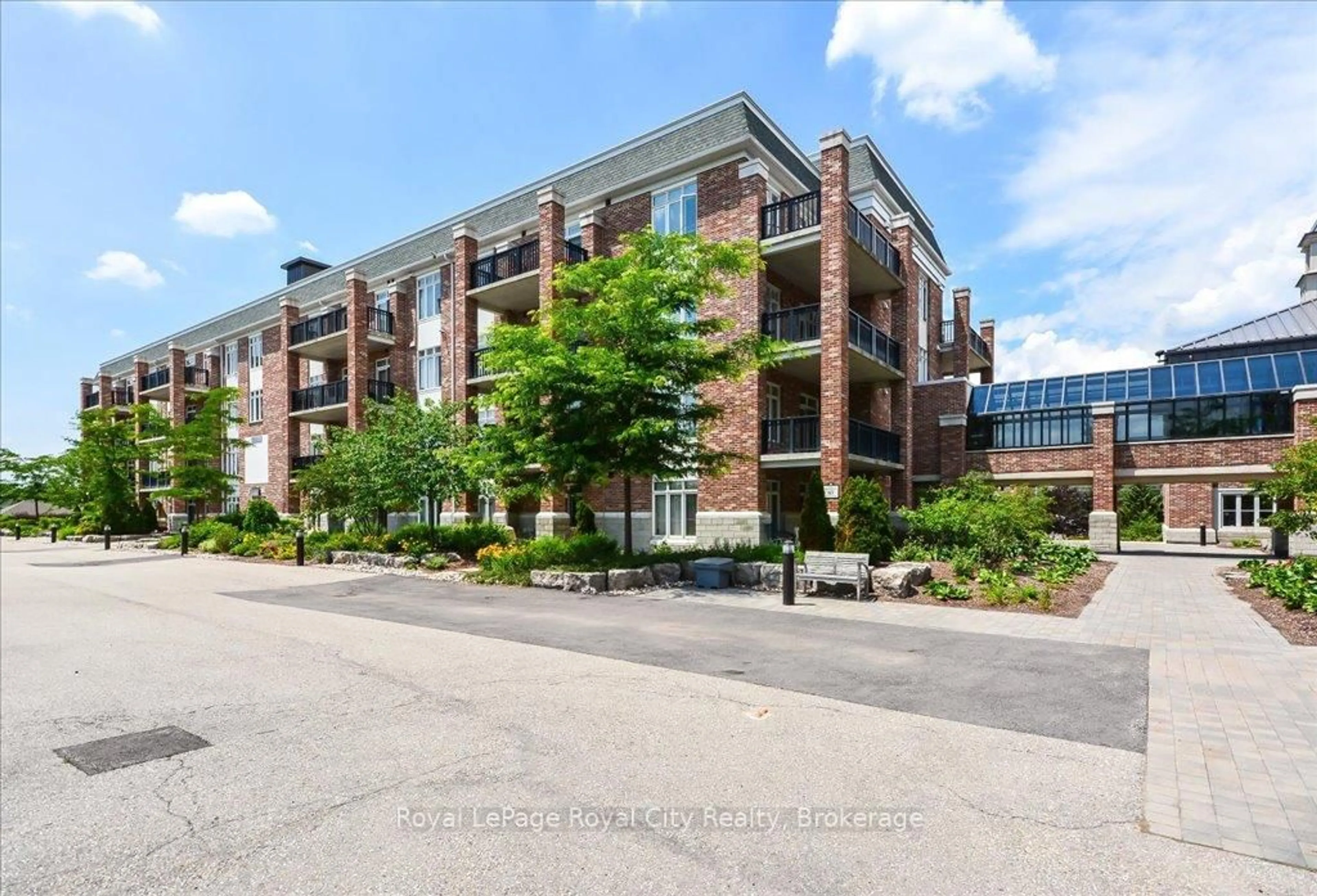 A pic from outside/outdoor area/front of a property/back of a property/a pic from drone, unknown for 65 Bayberry Dr #401, Guelph Ontario N1G 5K9