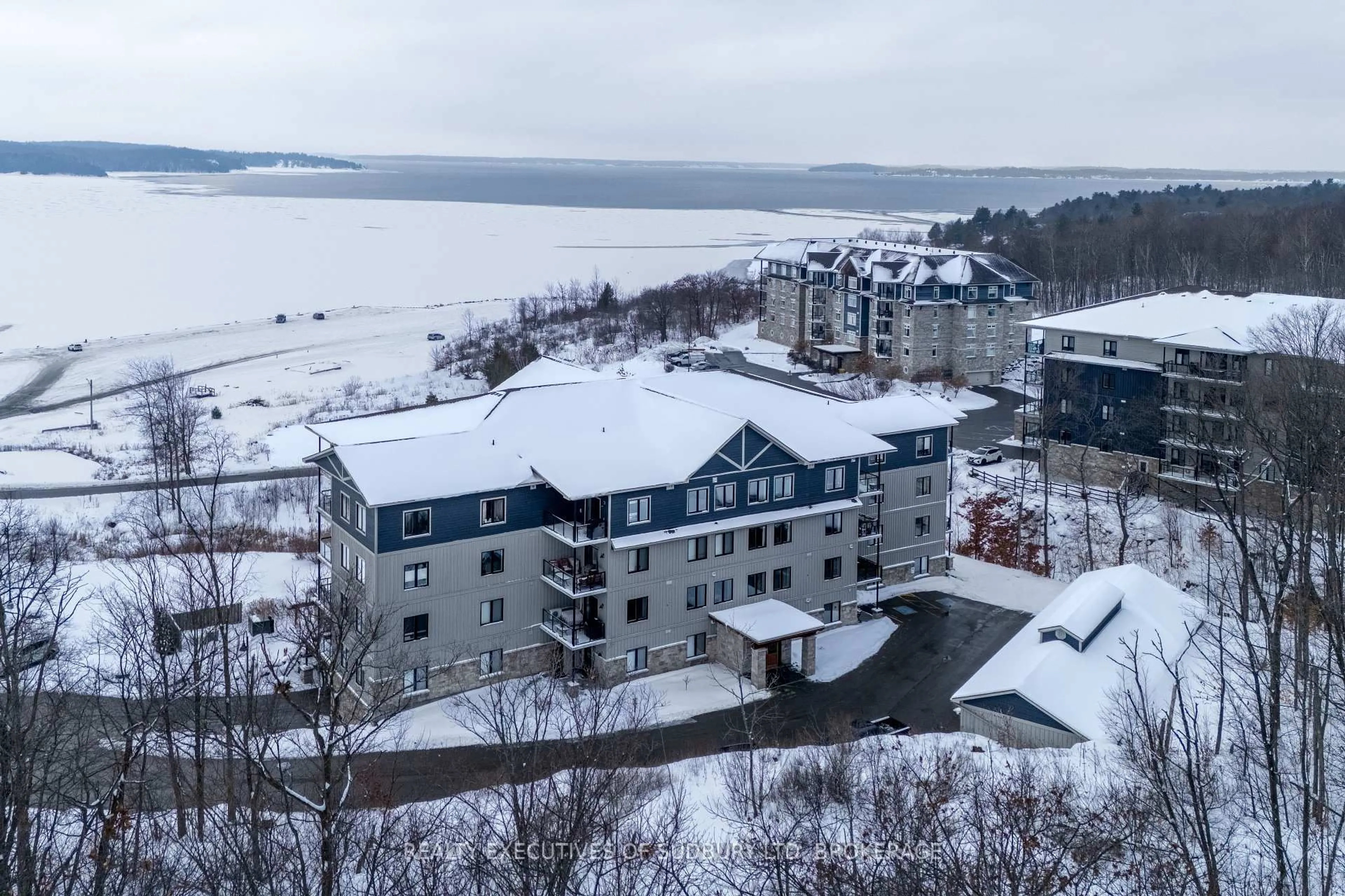 A pic from outside/outdoor area/front of a property/back of a property/a pic from drone, water/lake/river/ocean view for 11C Salt Dock Rd #404, Parry Sound Ontario P2A 3B6