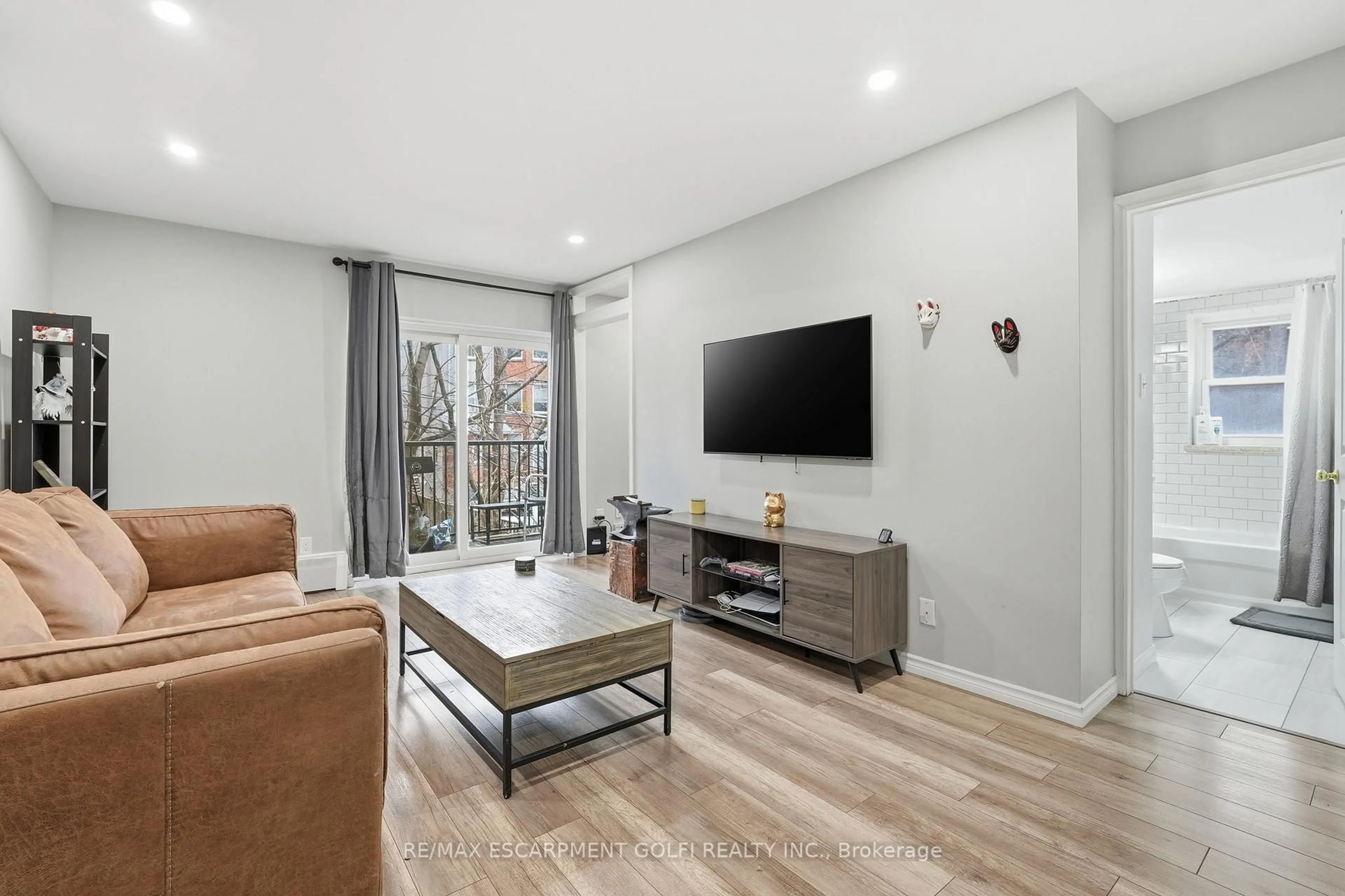 Living room with furniture, unknown for 40 Robinson St #308, Hamilton Ontario L8P 1Y9