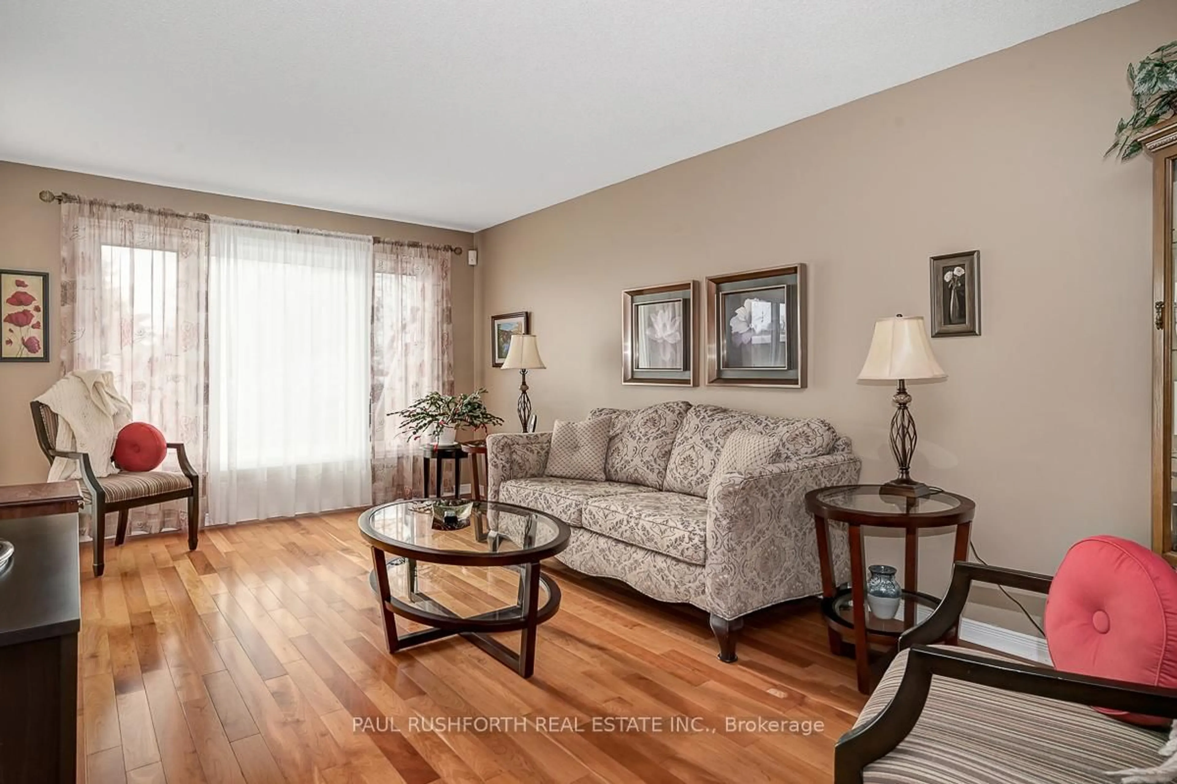 Living room with furniture, wood/laminate floor for 23 Willwood Cres, Ottawa Ontario K2J 4B2