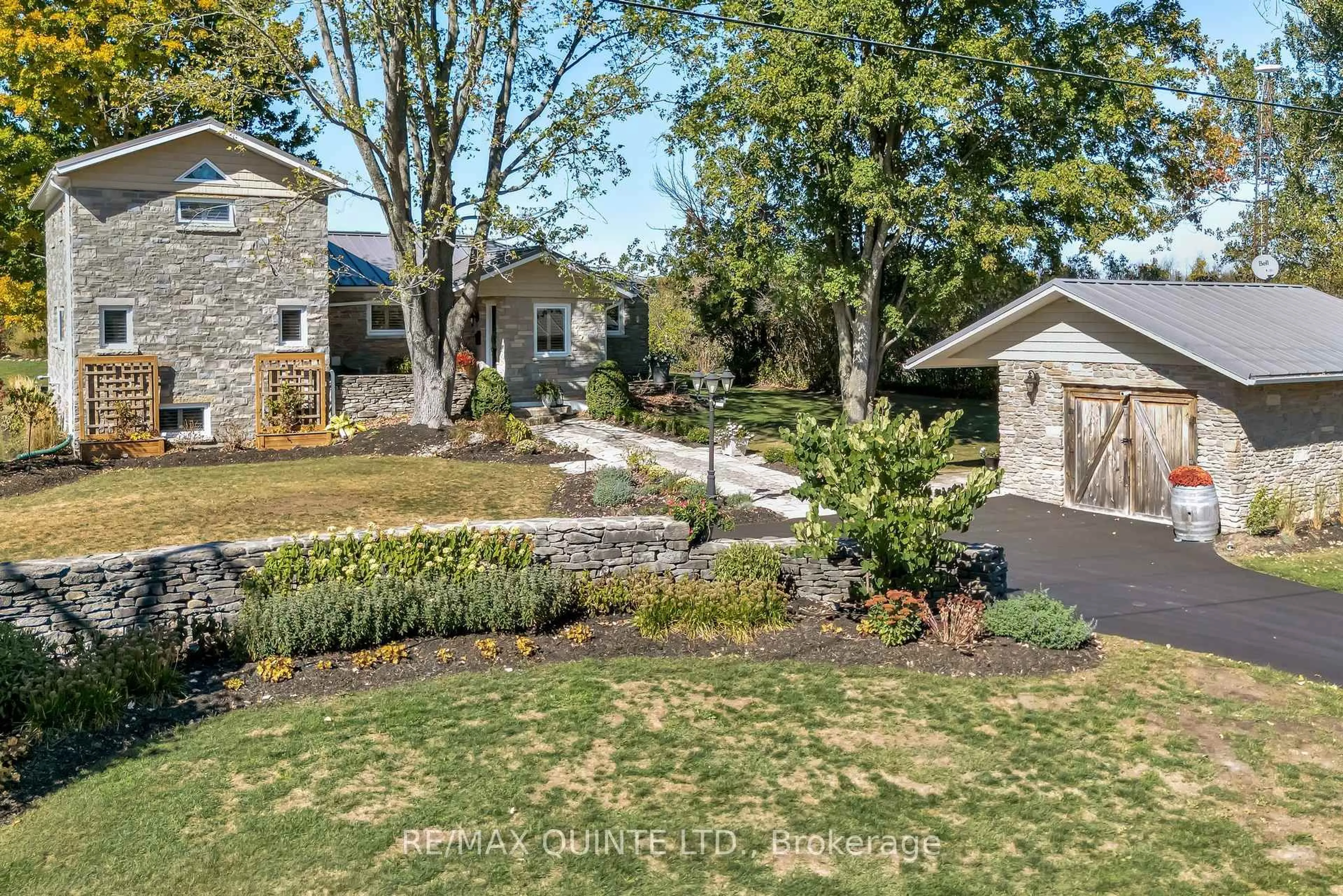 A pic from outside/outdoor area/front of a property/back of a property/a pic from drone, street for 1245 Miller Rd, Prince Edward County Ontario K0K 2T0