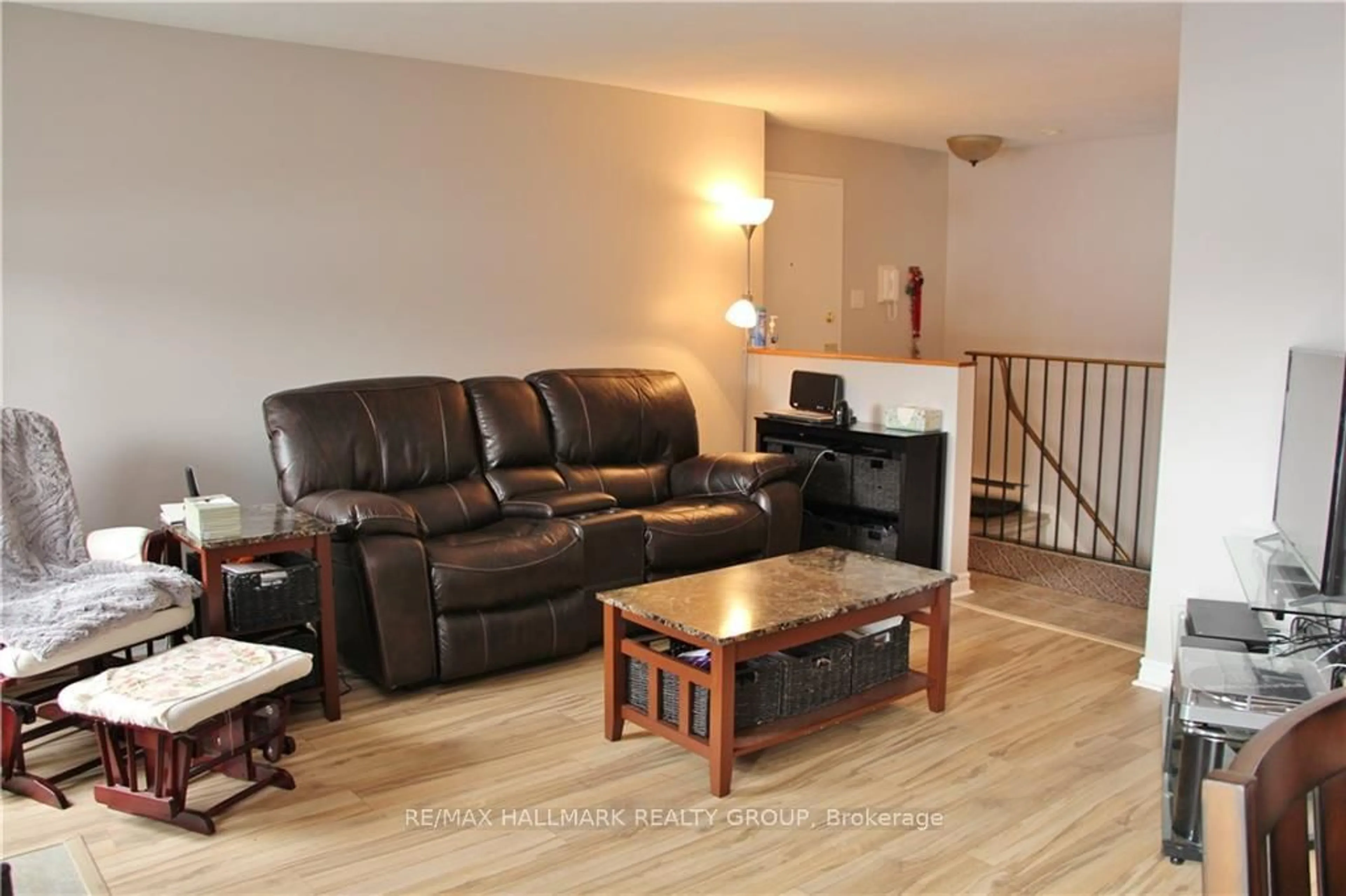 Living room with furniture, wood/laminate floor for 14 Sweetbriar Circ #4, Ottawa Ontario K2J 2K4