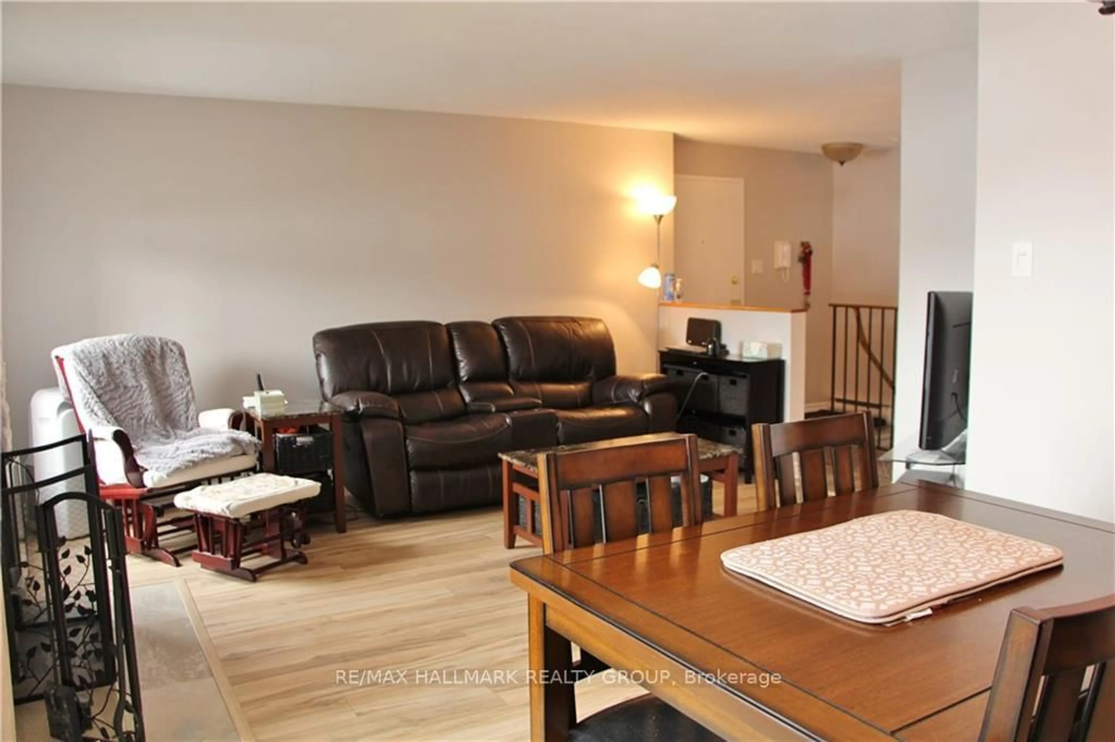 Living room with furniture, wood/laminate floor for 14 Sweetbriar Circ #4, Ottawa Ontario K2J 2K4