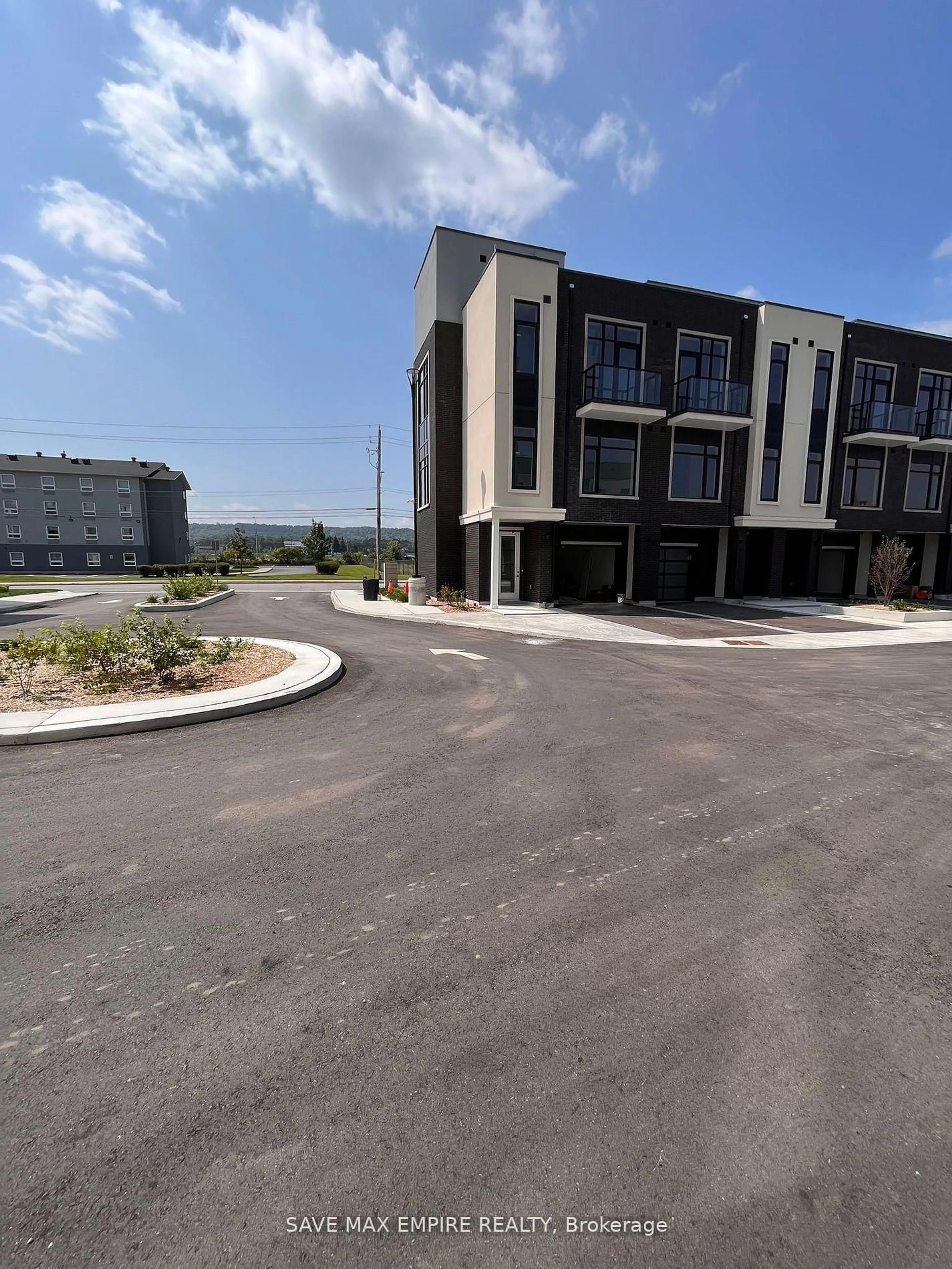 A pic from outside/outdoor area/front of a property/back of a property/a pic from drone, street for 385 Winston Rd #502, Grimsby Ontario L3M 0J3