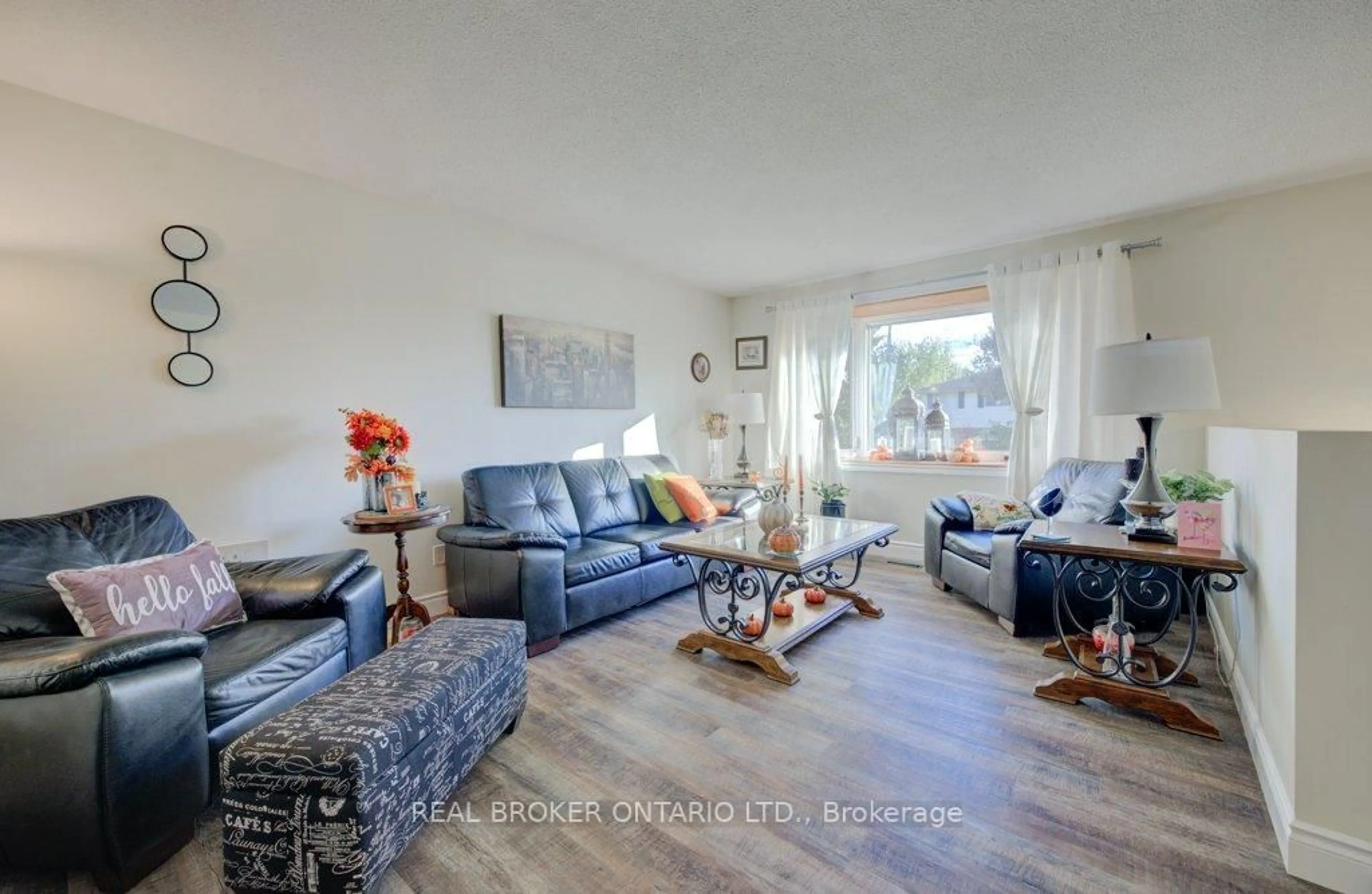 Living room with furniture, wood/laminate floor for 34 Willow Green Crt, Kitchener Ontario N2N 1W6
