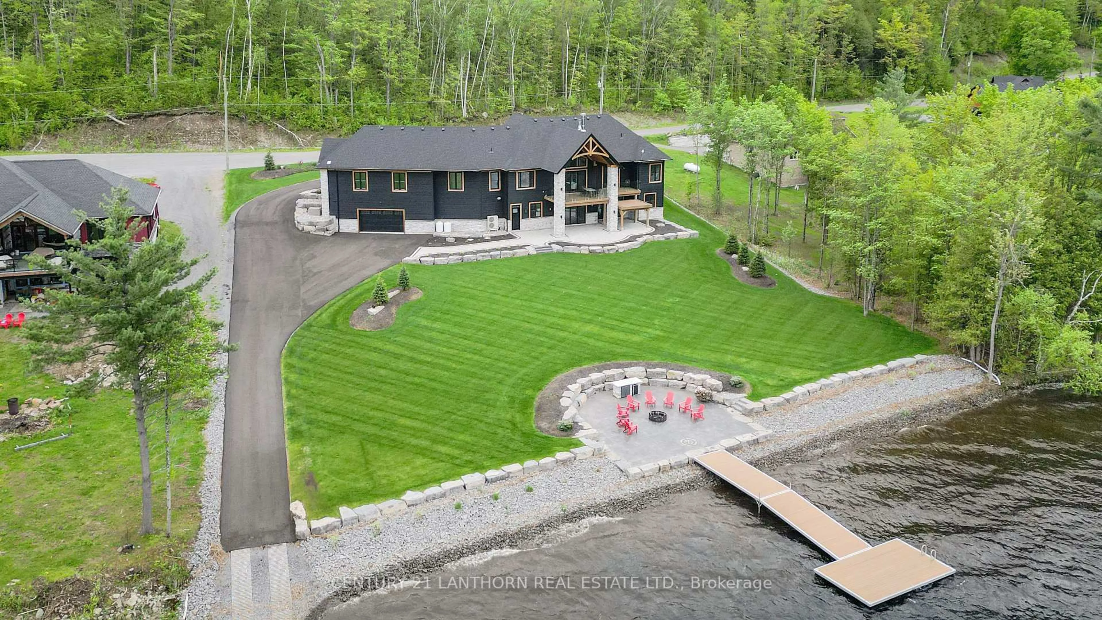 A pic from outside/outdoor area/front of a property/back of a property/a pic from drone, water/lake/river/ocean view for 555 Mile Point Lane, Madoc Ontario K0K 2K0