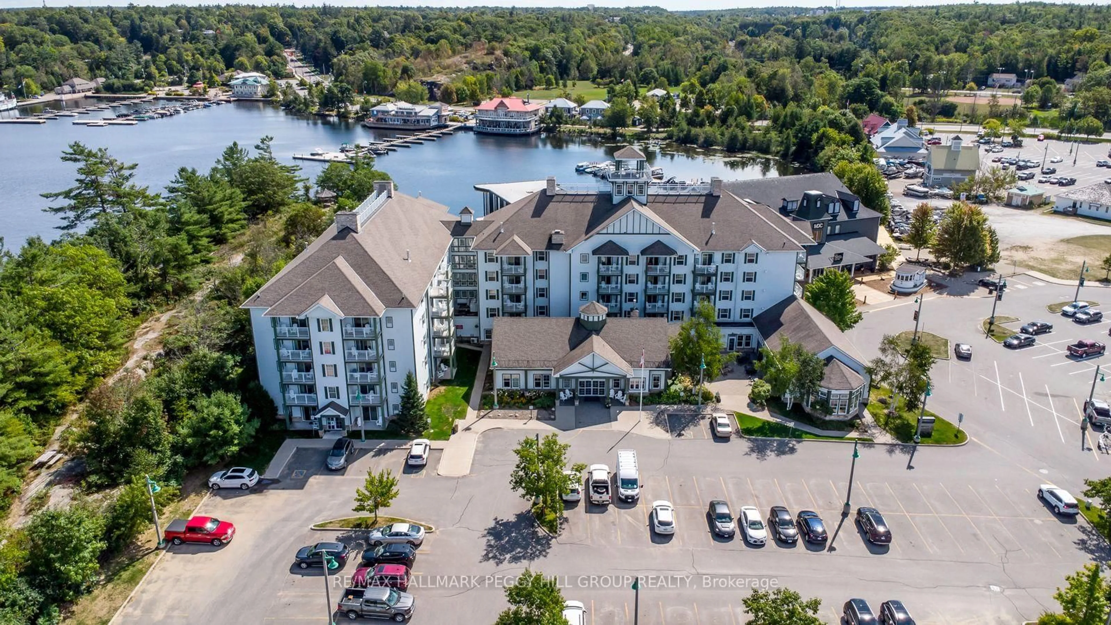 A pic from outside/outdoor area/front of a property/back of a property/a pic from drone, water/lake/river/ocean view for 285 Steamship Bay Rd #410, Gravenhurst Ontario P1P 1Z9