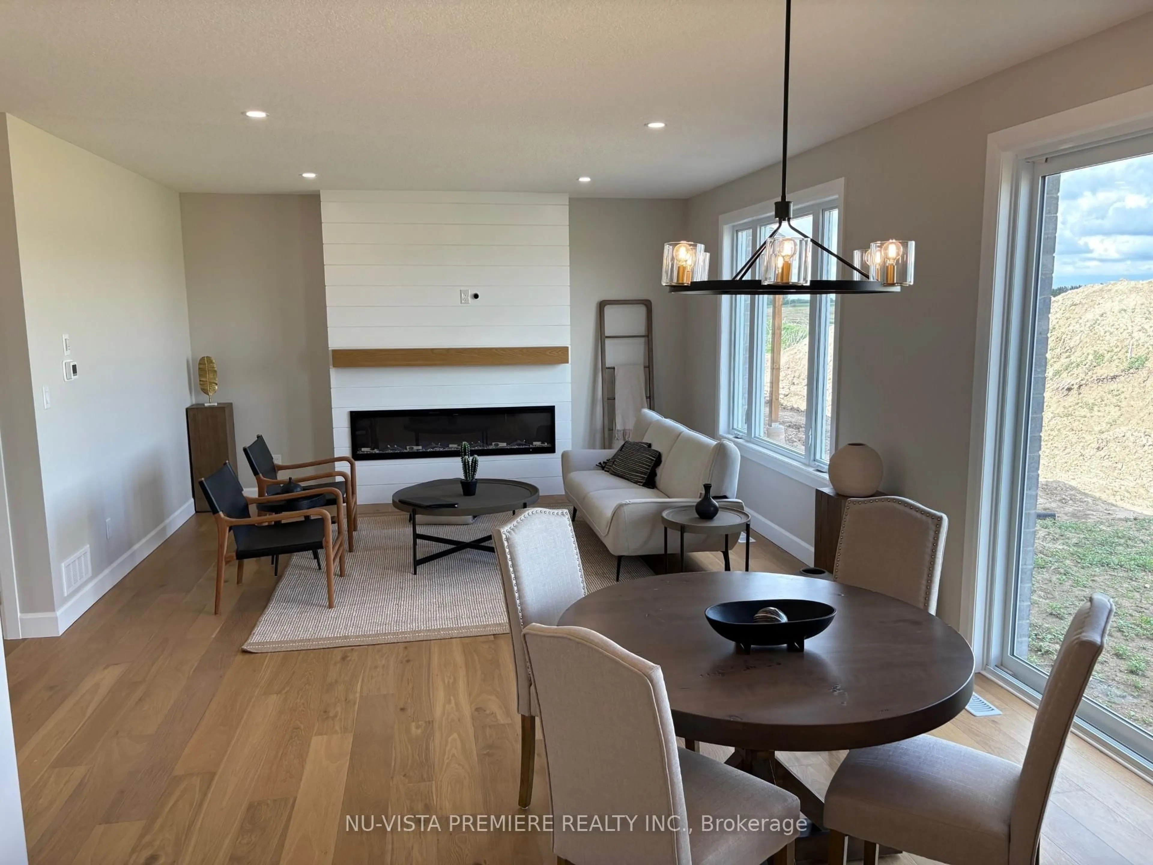 Living room with furniture, wood/laminate floor for 162 Watts Dr, Lucan Biddulph Ontario N0M 2J0