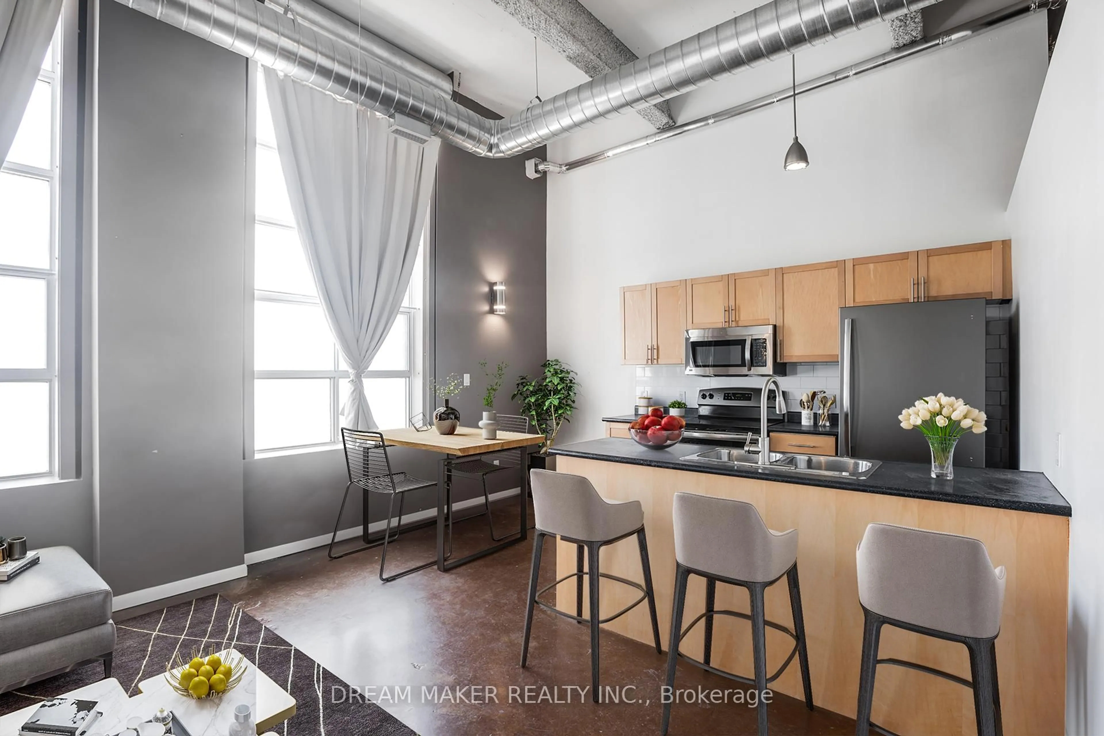 Open concept kitchen, cement floor for 11 Rebecca St, Hamilton Ontario L8R 3H7