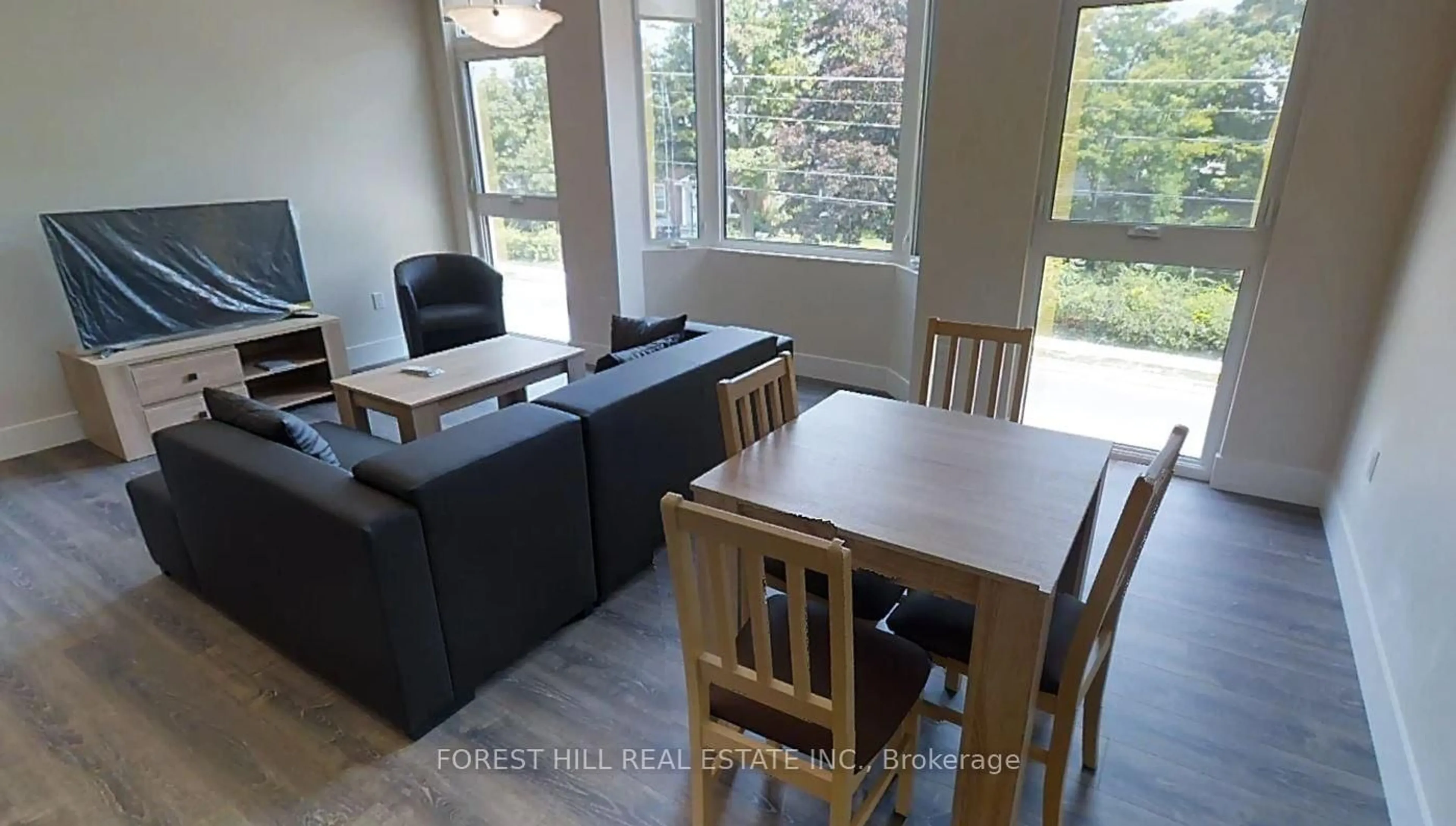 Dining room, wood/laminate floor for 253 Albert St #108, Waterloo Ontario N2L 3T7