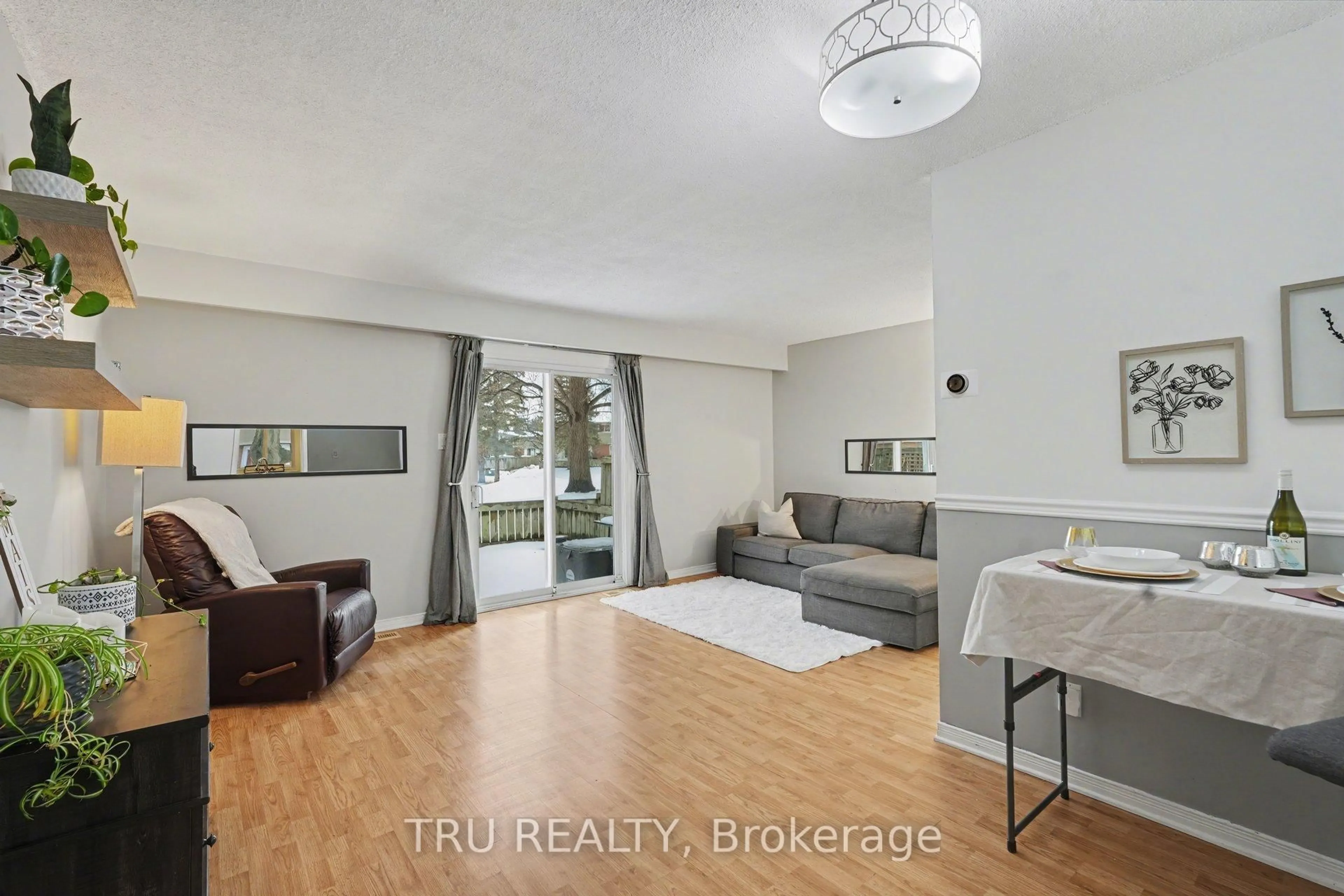 Living room with furniture, wood/laminate floor for 463F Moodie Dr, Ottawa Ontario K2H 8T7