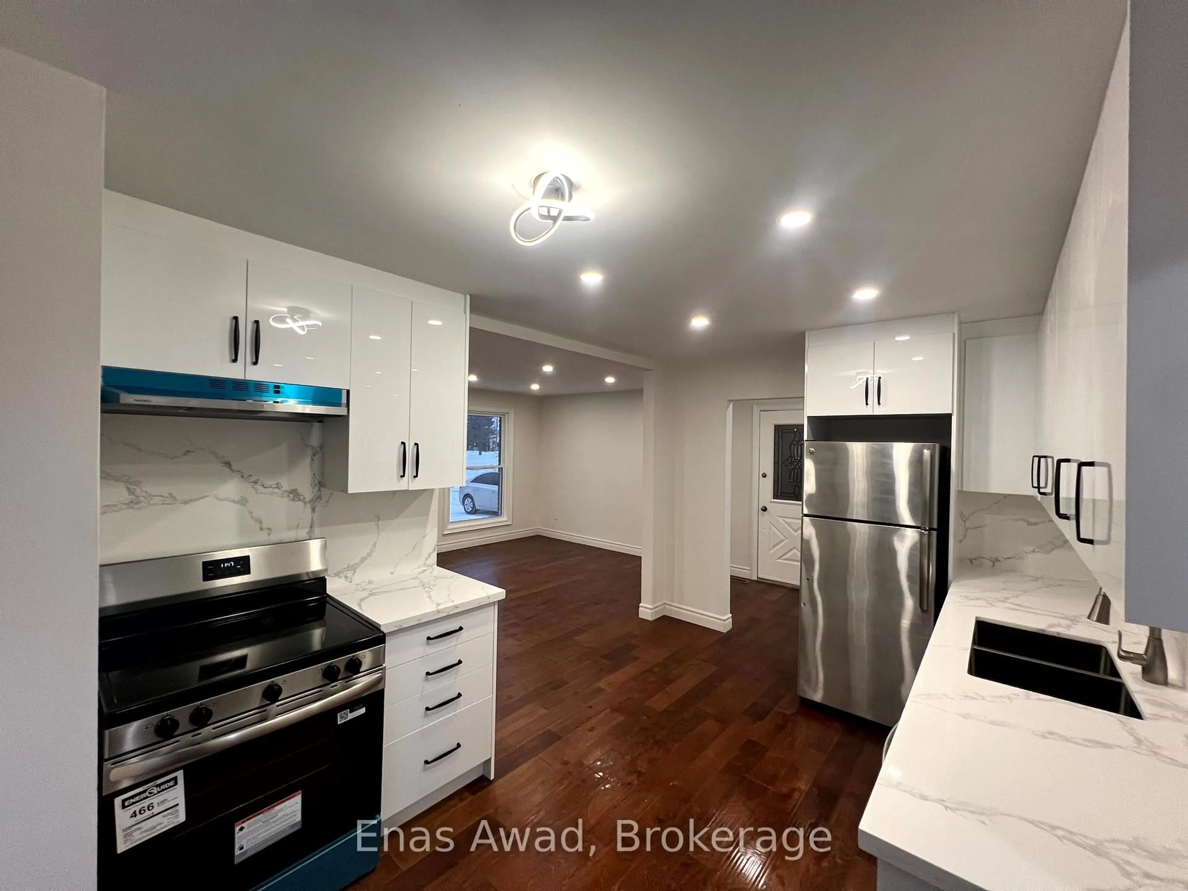 Open concept kitchen, wood/laminate floor for 1402 Clearview Dr, Peterborough Ontario K9K 1Z8