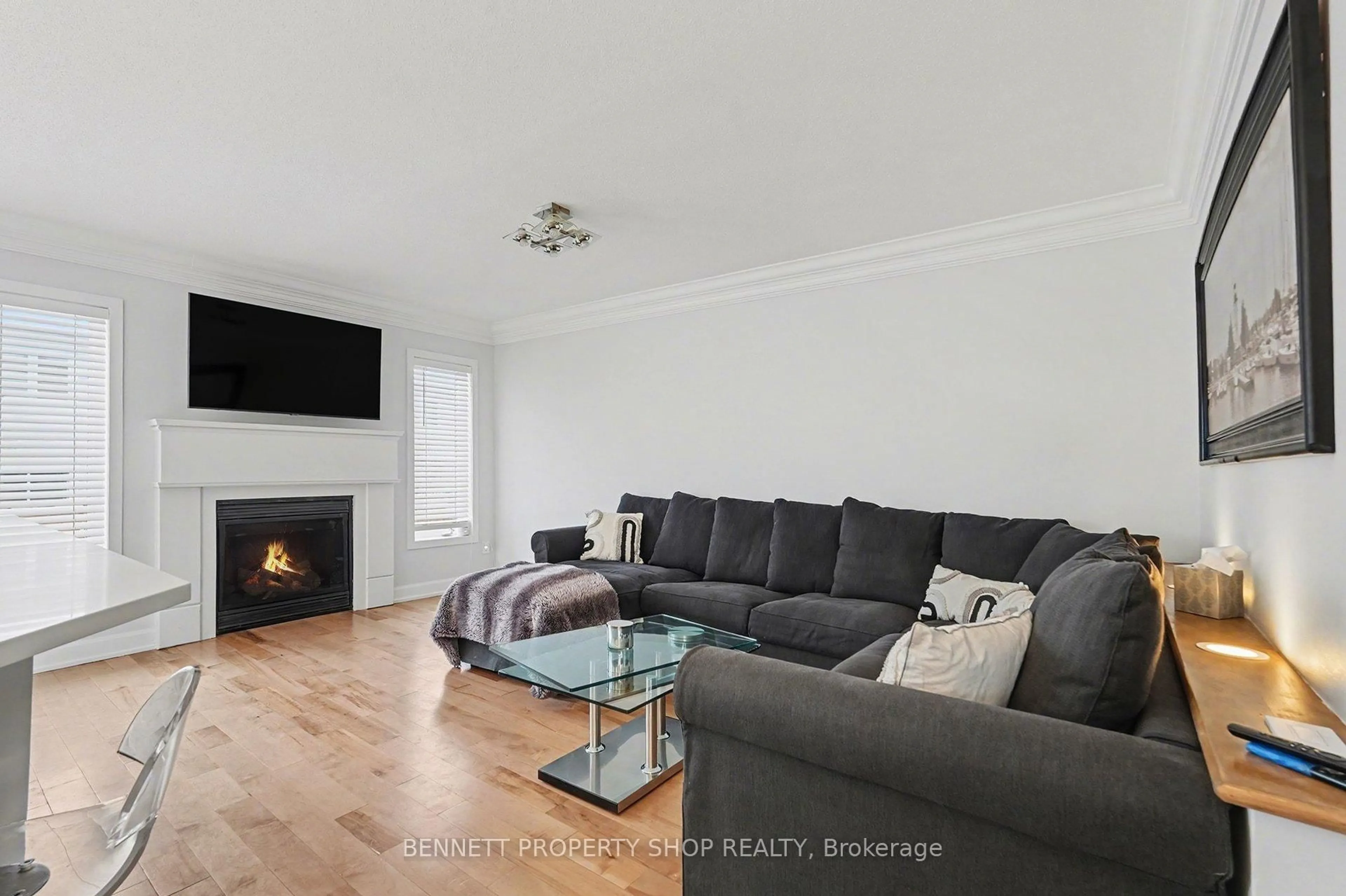 Living room with furniture, wood/laminate floor for 427 Montserrat St, Ottawa Ontario K2S 0L6