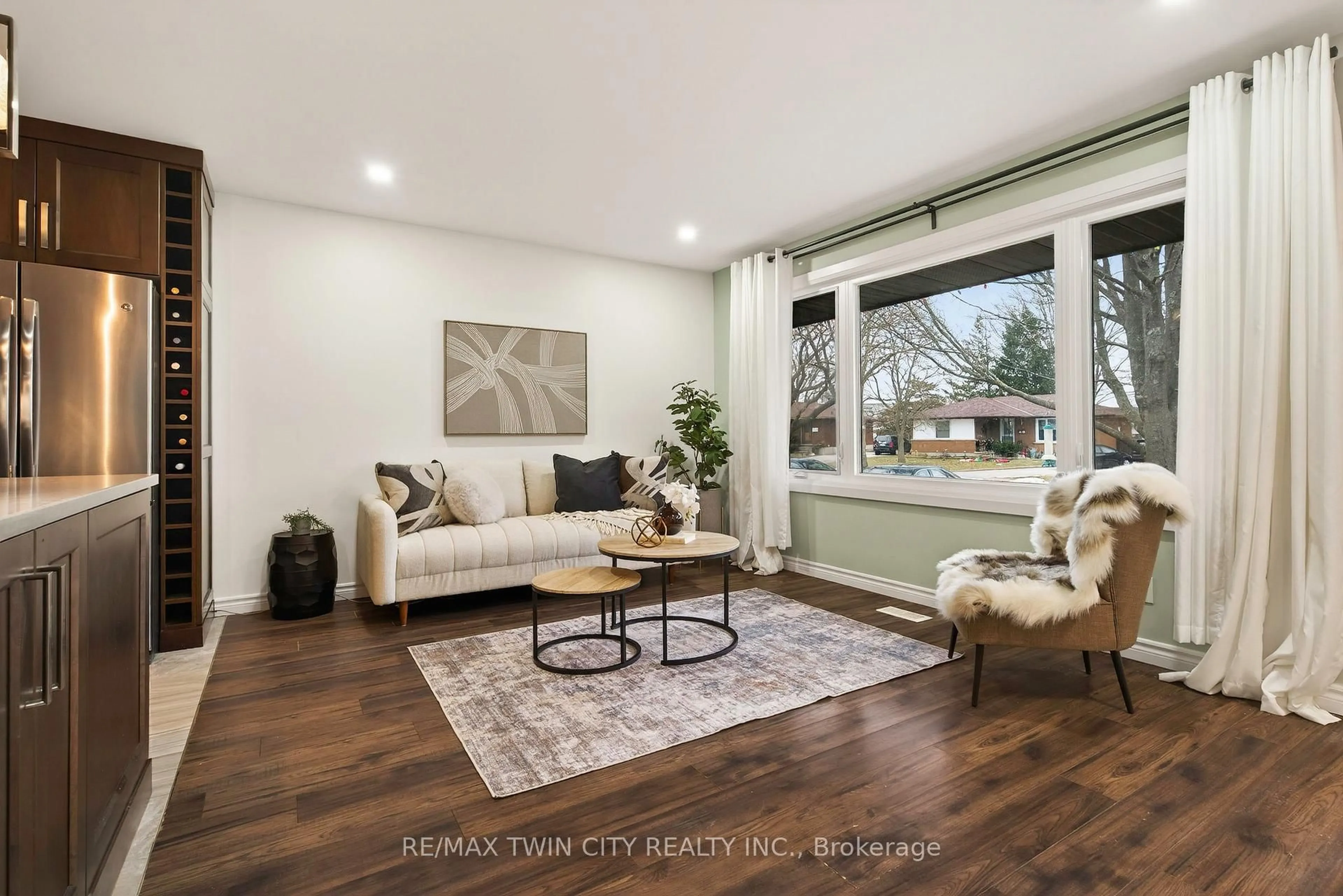 Living room with furniture, wood/laminate floor for 43 Blueridge Cres, Brantford Ontario N3R 5E6