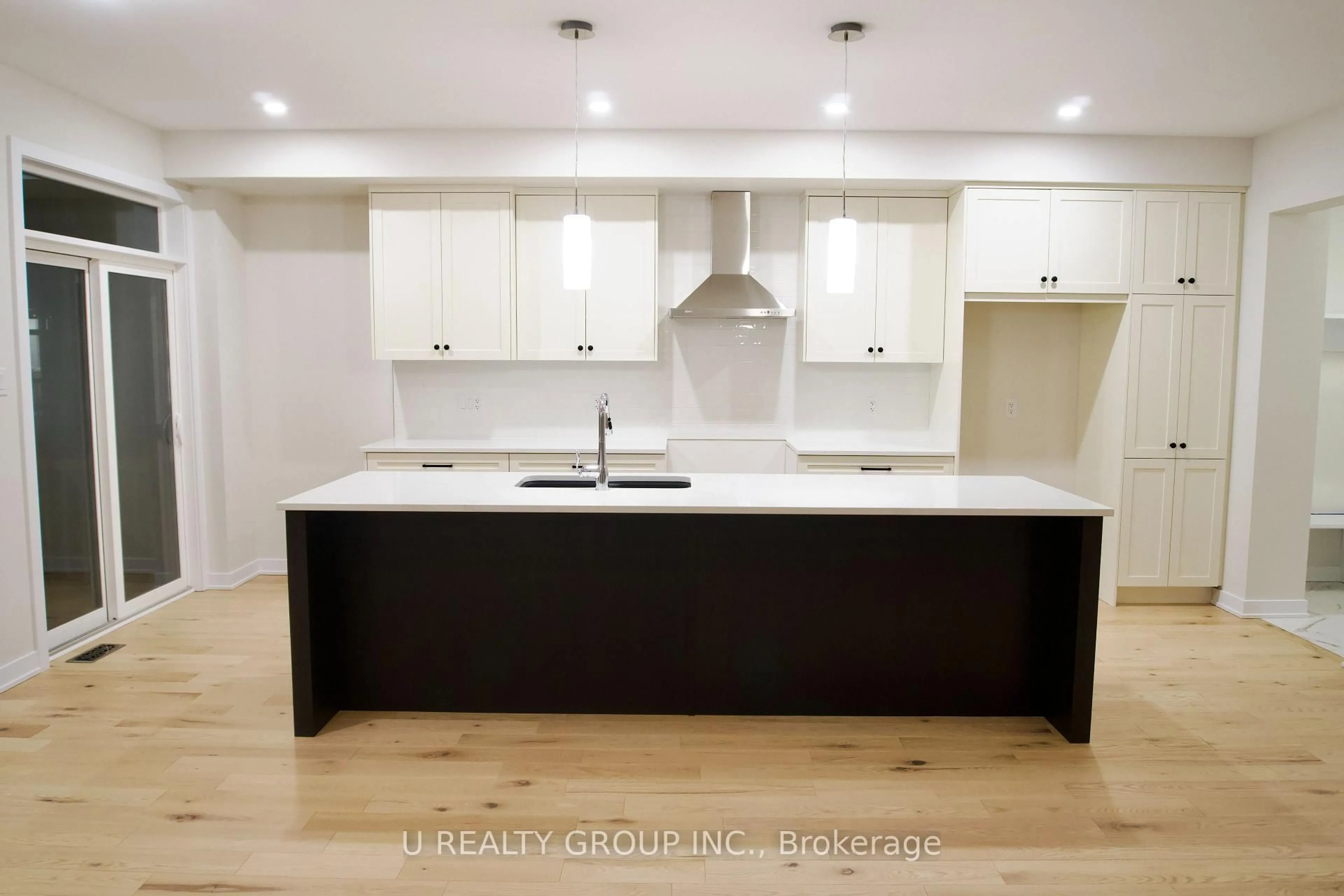 Contemporary kitchen, wood/laminate floor for 217 Massalia Cres, Orleans Ontario K4A 5L9