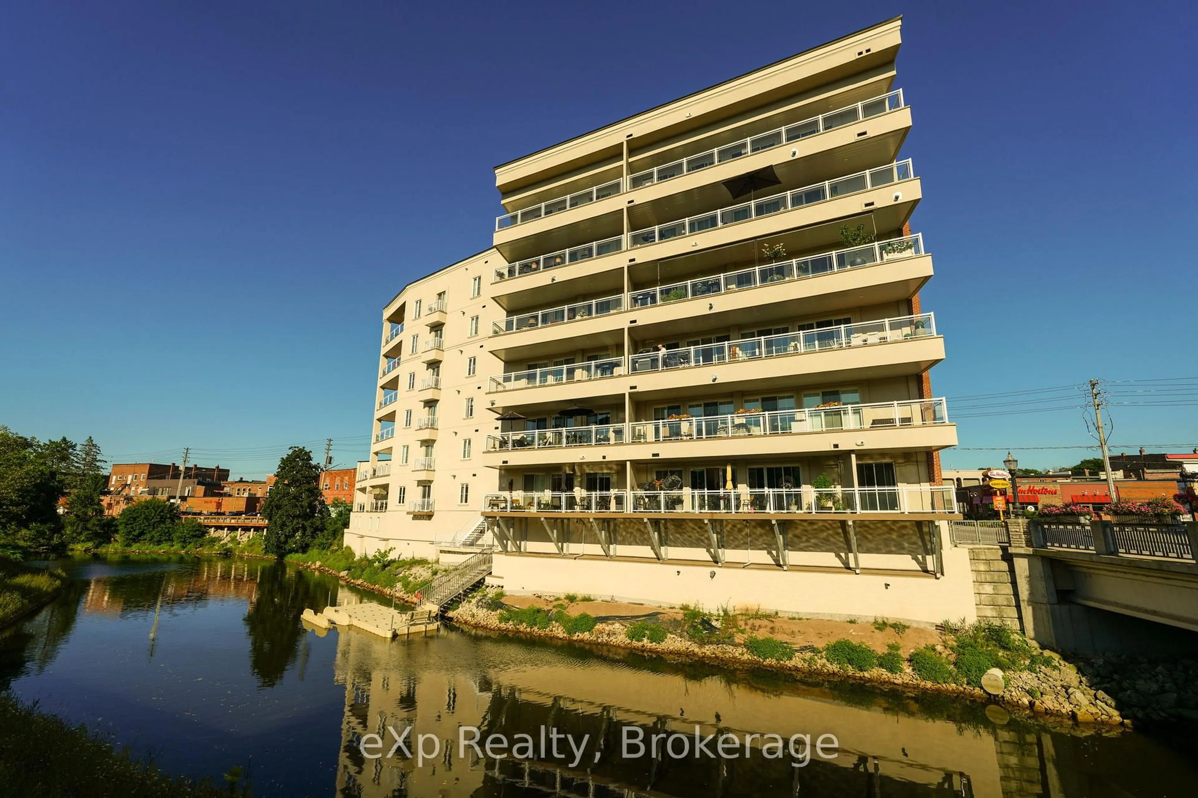 A pic from outside/outdoor area/front of a property/back of a property/a pic from drone, water/lake/river/ocean view for 80 9th St #203, Owen Sound Ontario N4K 1N4