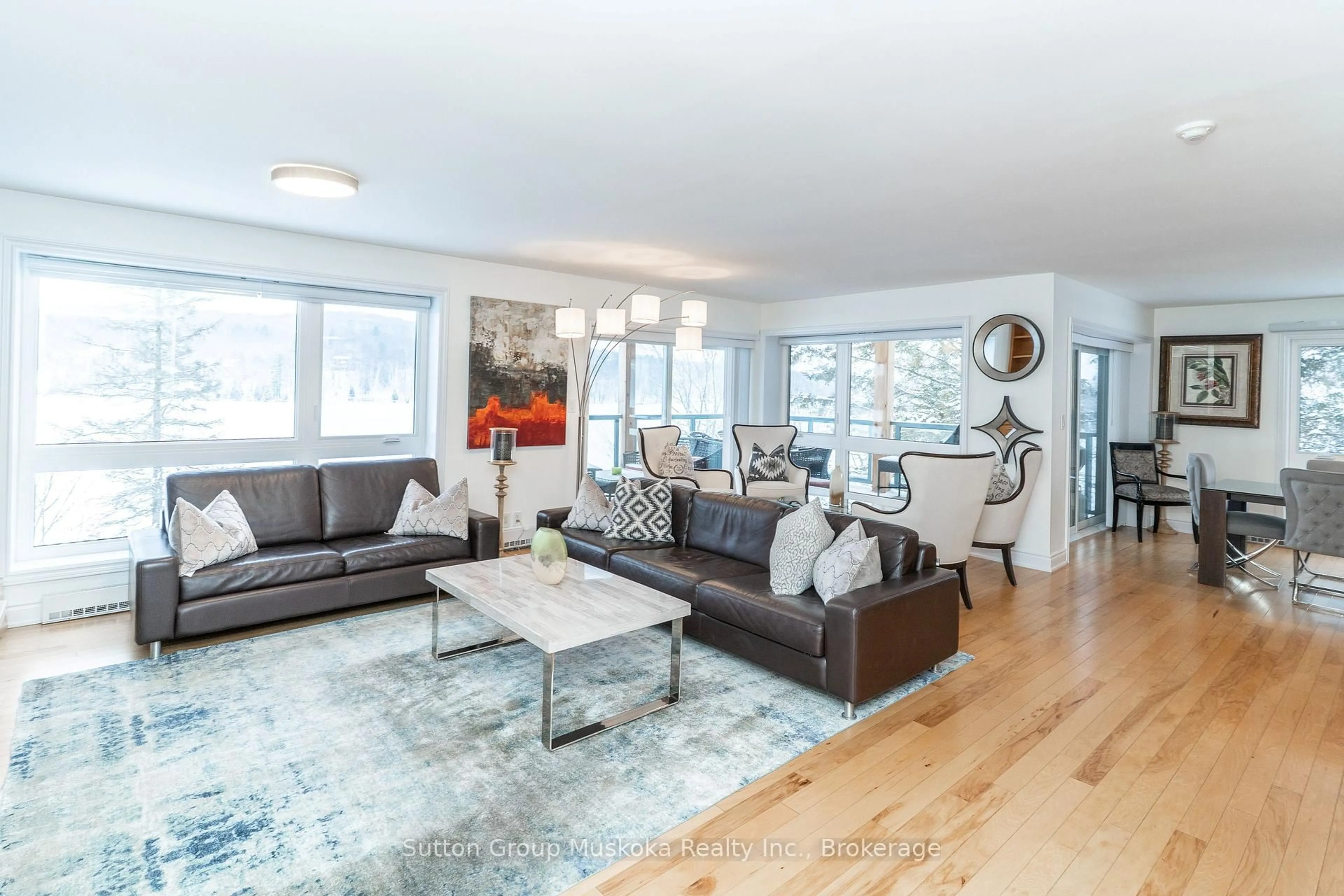 Living room with furniture, wood/laminate floor for 1235 Deerhurst Dr #Building 6 - Unit 203, Huntsville Ontario P1H 2E8