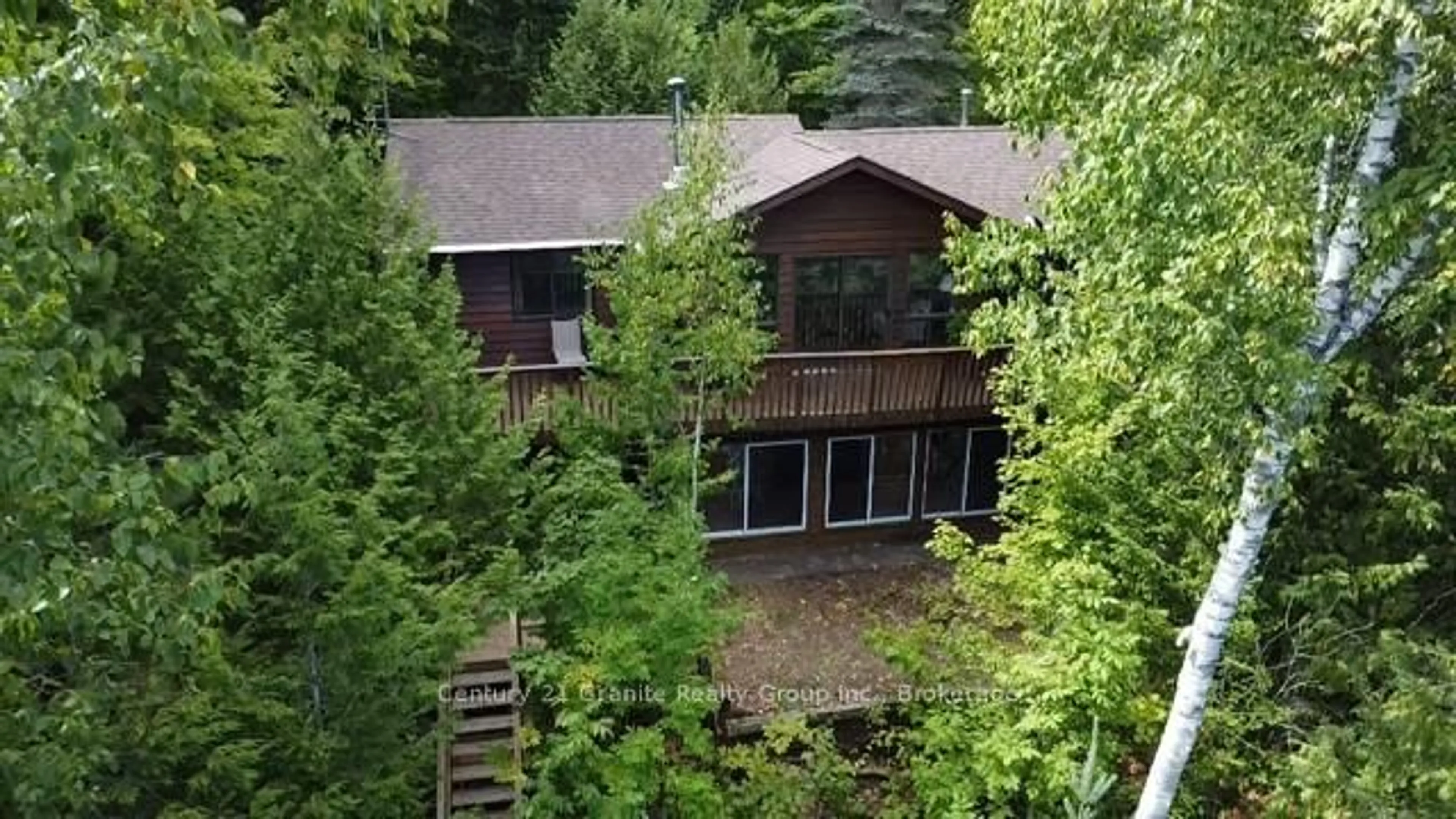 A pic from outside/outdoor area/front of a property/back of a property/a pic from drone, forest/trees view for 1119 Wampum Rd, Dysart et al Ontario K0M 1S0