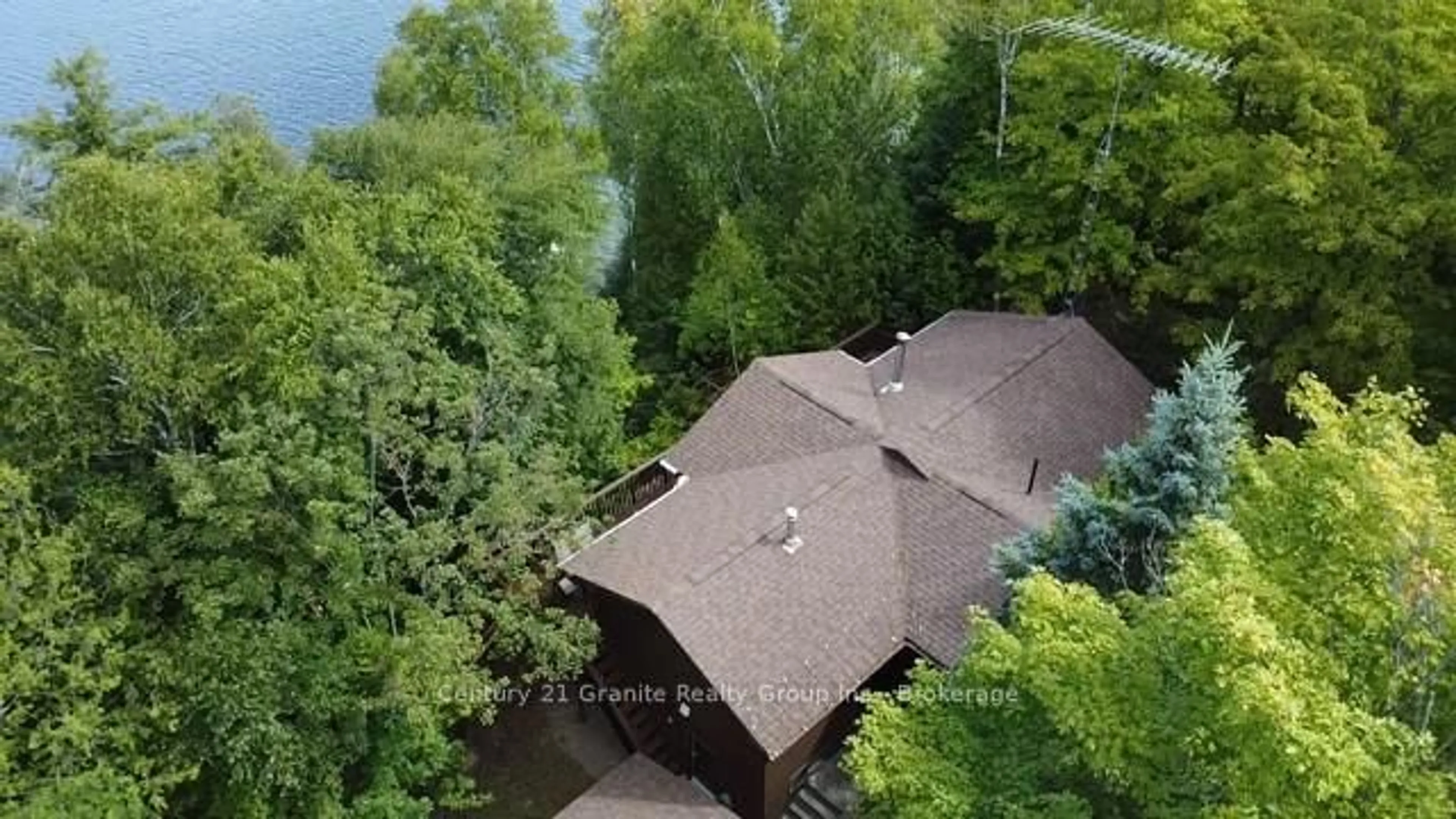 A pic from outside/outdoor area/front of a property/back of a property/a pic from drone, water/lake/river/ocean view for 1119 Wampum Rd, Dysart et al Ontario K0M 1S0