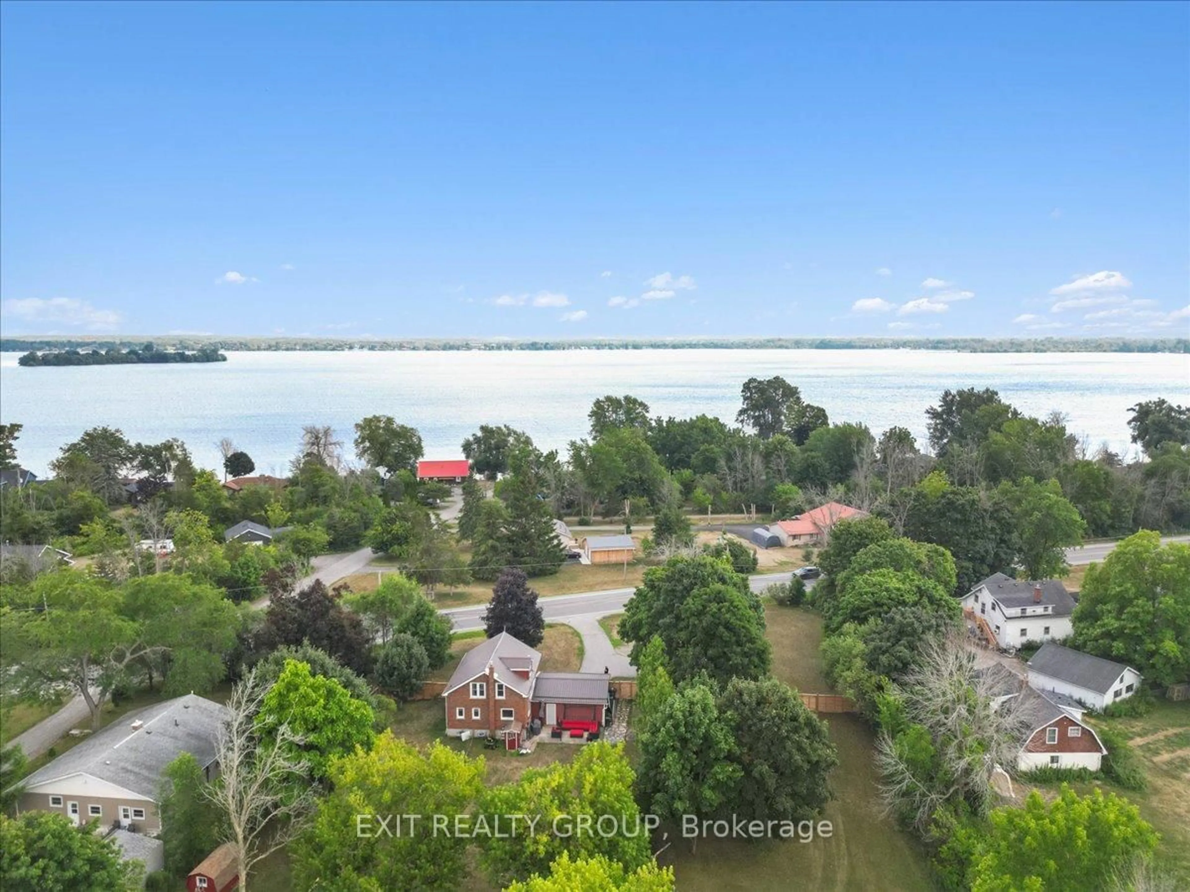 A pic from outside/outdoor area/front of a property/back of a property/a pic from drone, water/lake/river/ocean view for 22714 Loyalist Pkwy, Trenton Ontario K8V 5P7