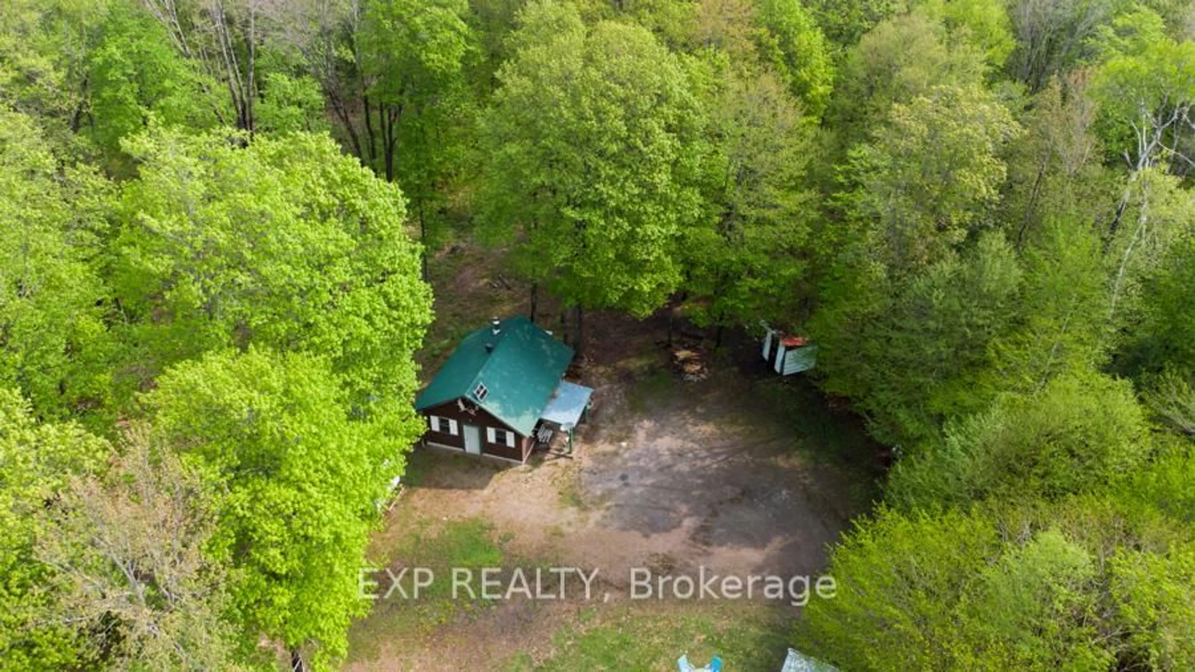 A pic from outside/outdoor area/front of a property/back of a property/a pic from drone, forest/trees view for 1040 Bill McLaren Tr, Dysart et al Ontario K0L 1X0