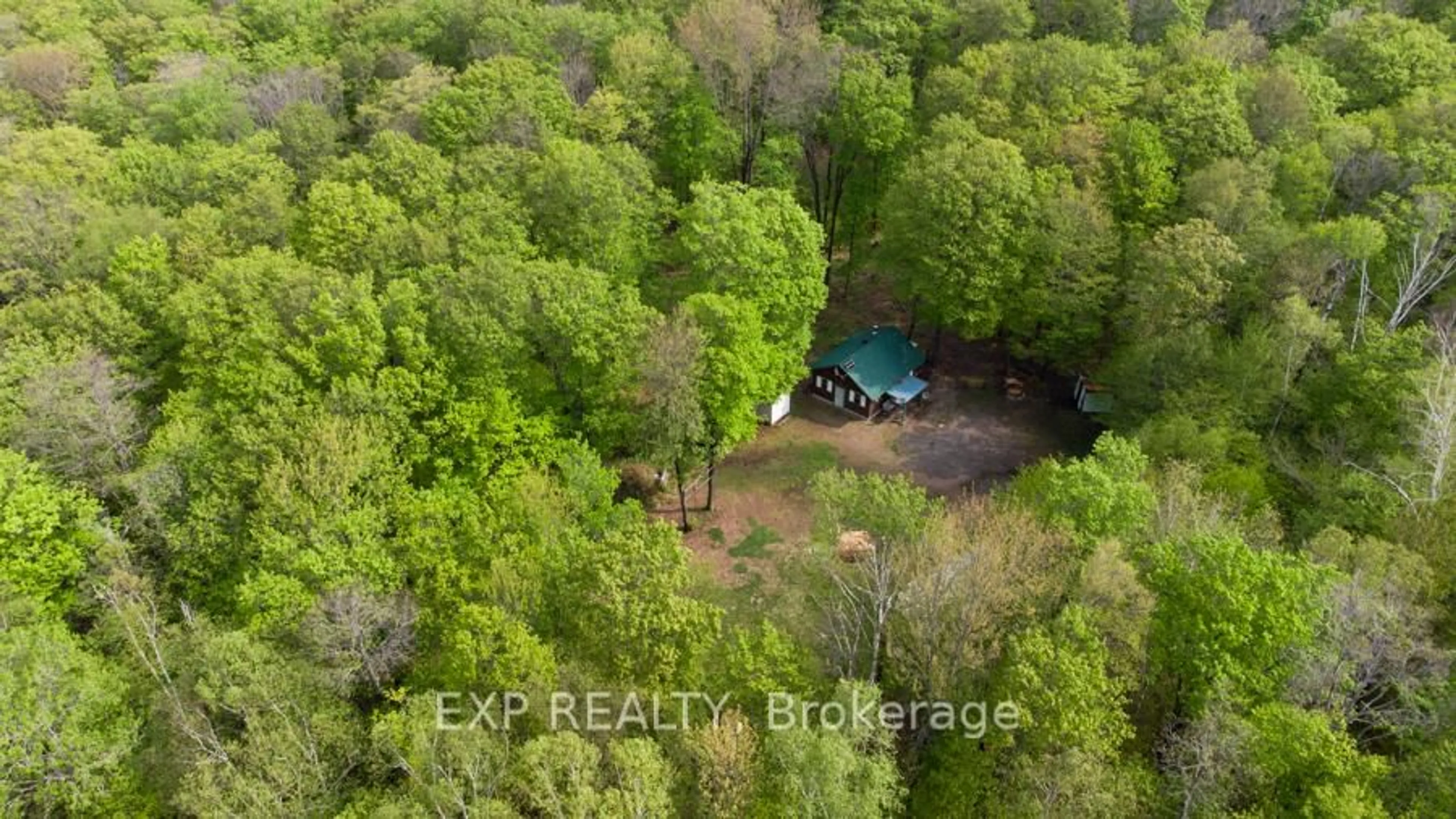 A pic from outside/outdoor area/front of a property/back of a property/a pic from drone, forest/trees view for 1040 Bill McLaren Tr, Dysart et al Ontario K0L 1X0