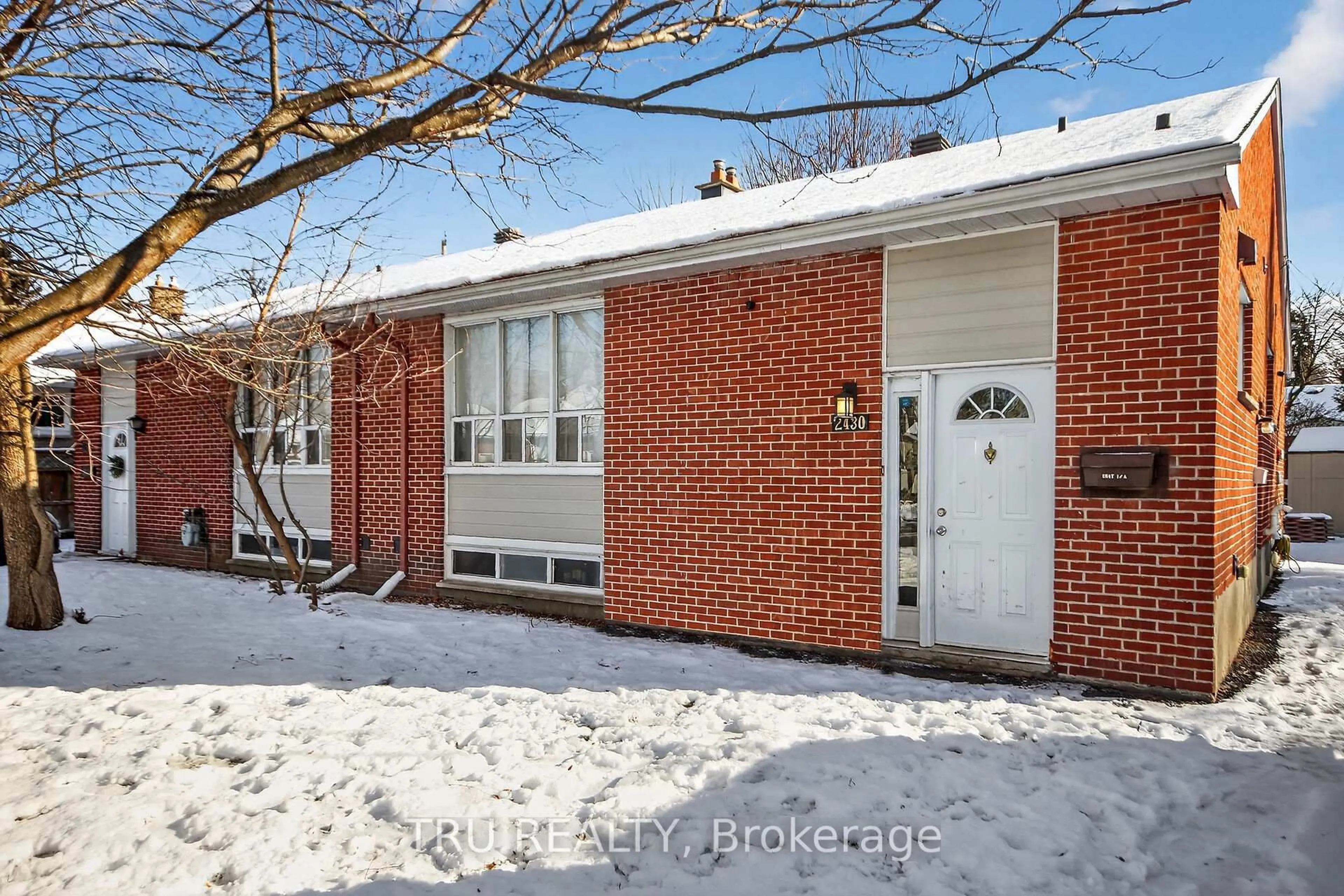 Home with brick exterior material, street for 2428-2430 Iris St, Ottawa Ontario K2C 1C6