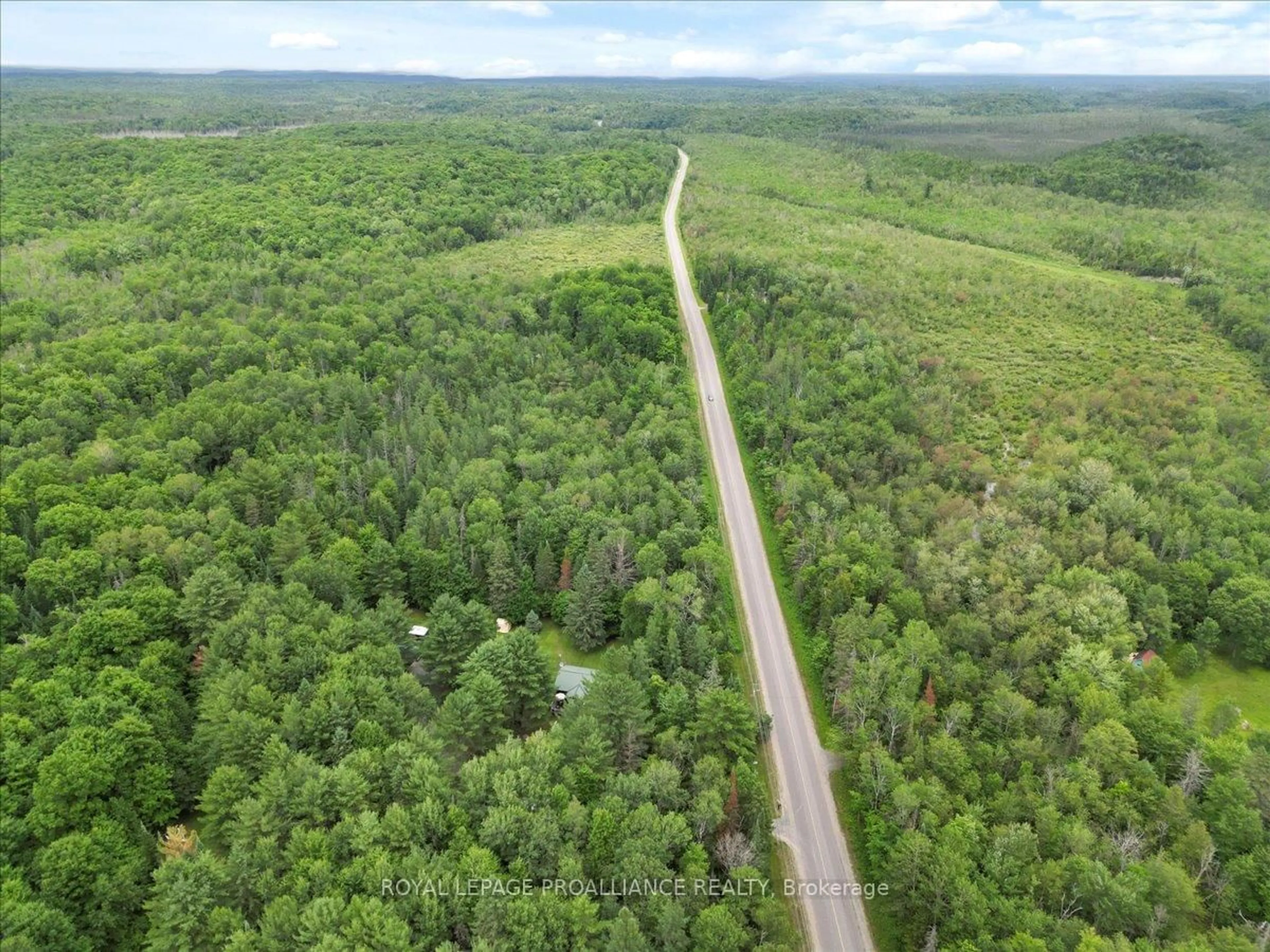 A pic from outside/outdoor area/front of a property/back of a property/a pic from drone, forest/trees view for 1151 Harlowe Road, R.R. #1, Frontenac Ontario K0H 2G0