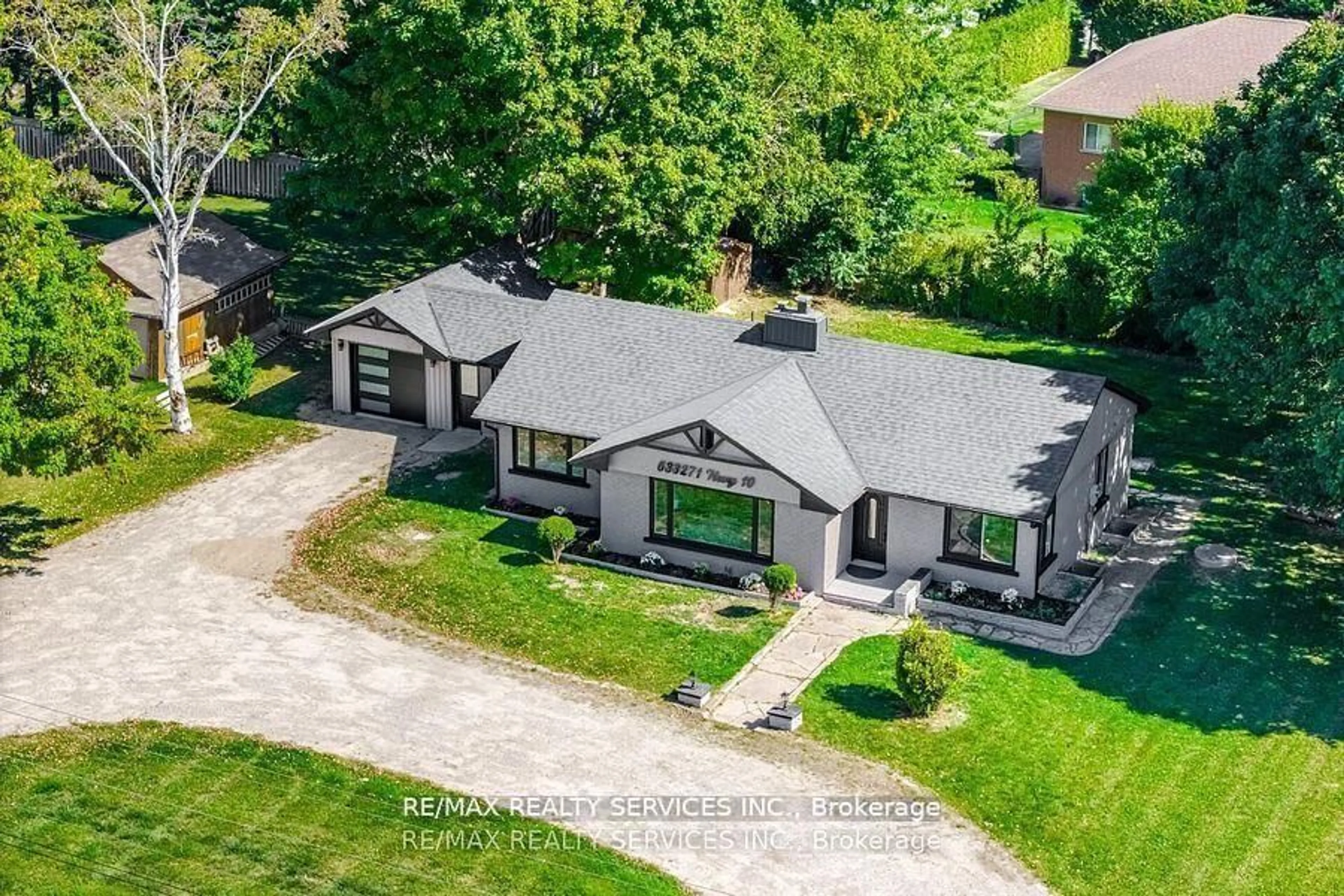 A pic from outside/outdoor area/front of a property/back of a property/a pic from drone, street for 633271 Hwy 10, Mono Ontario L9W 5P1