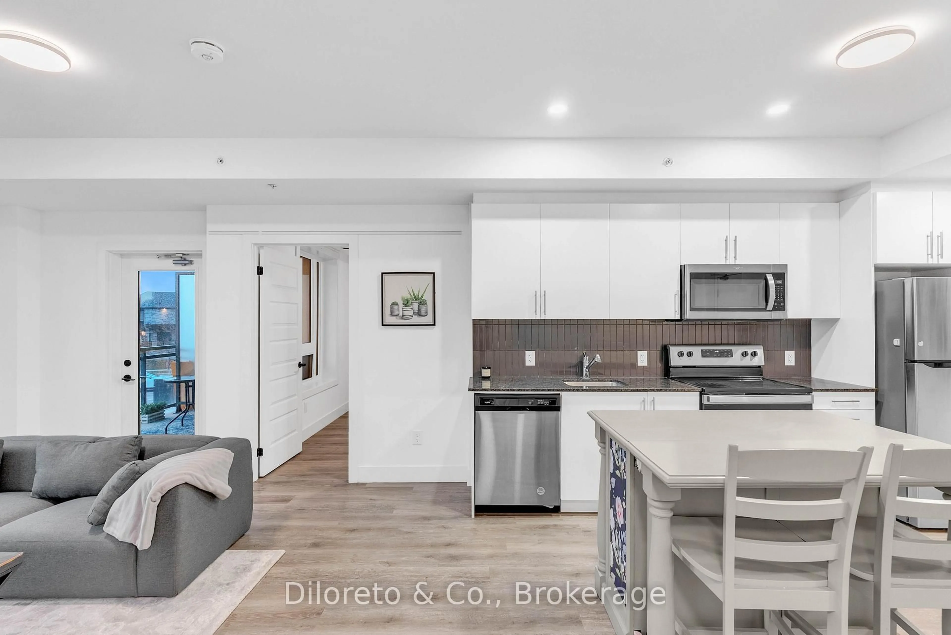 Open concept kitchen, ceramic/tile floor for 26 Lowes Rd #207, Guelph Ontario N1G 4X2