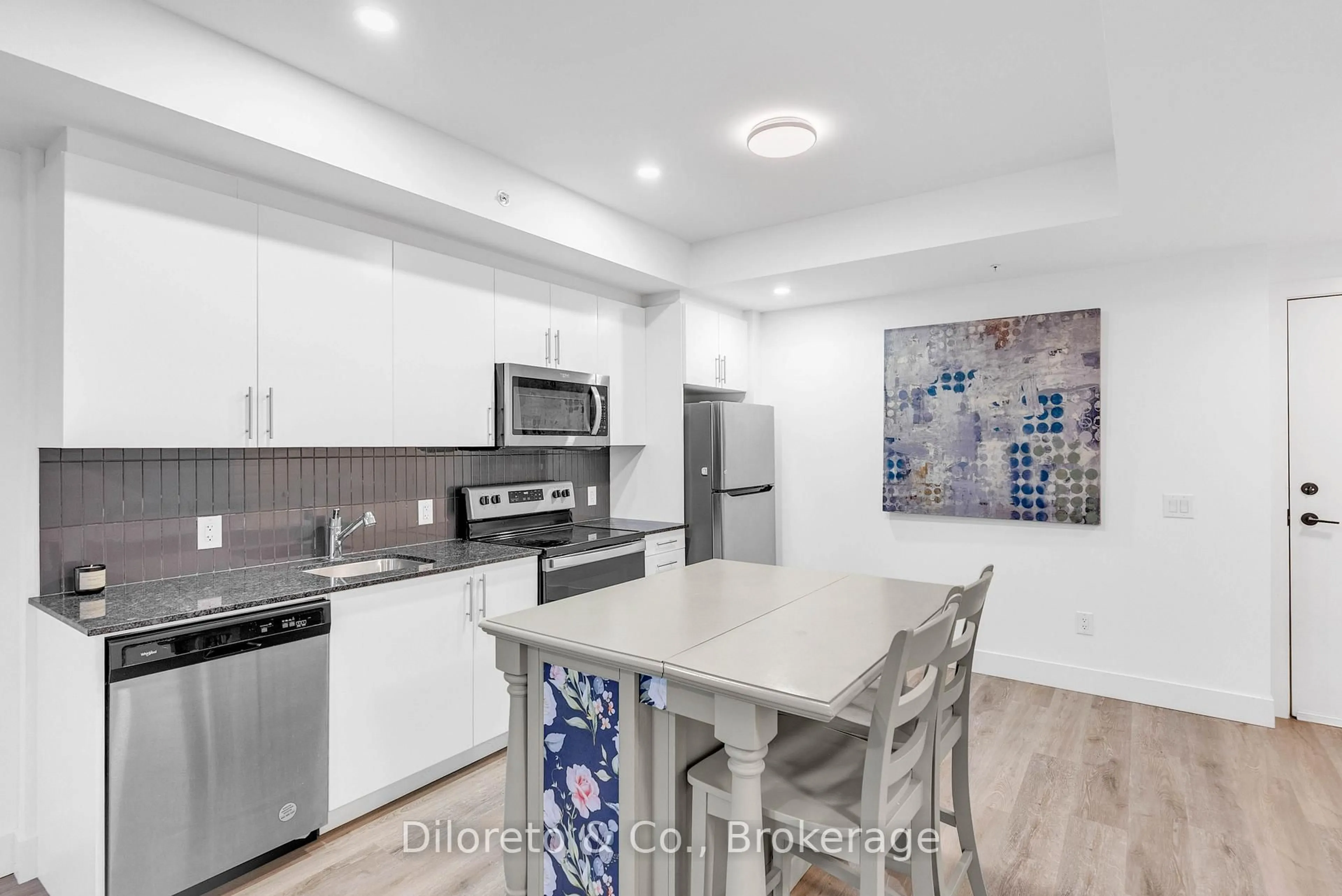 Open concept kitchen, ceramic/tile floor for 26 Lowes Rd #207, Guelph Ontario N1G 4X2