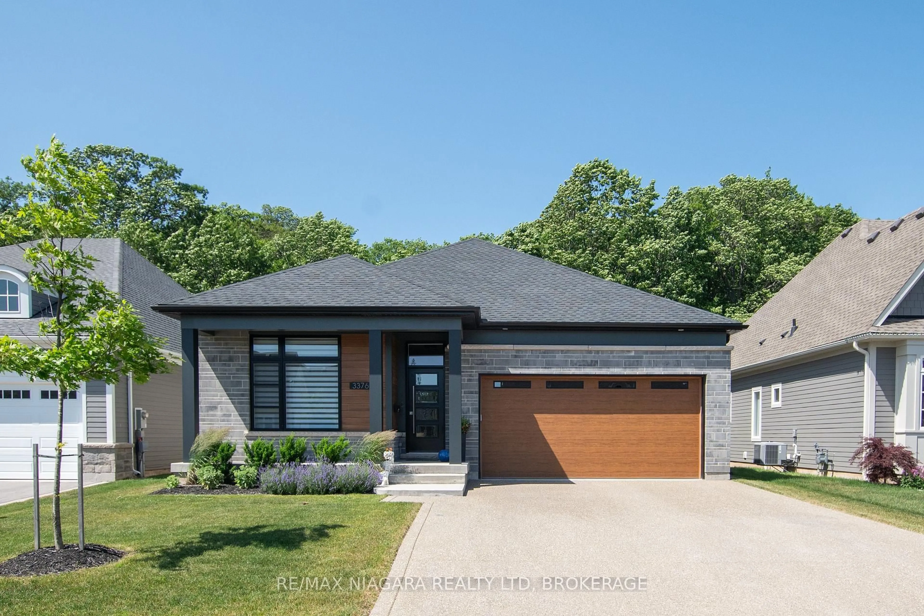 Home with brick exterior material, street for 3376 Whispering Woods Tr, Fort Erie Ontario L0S 1N0