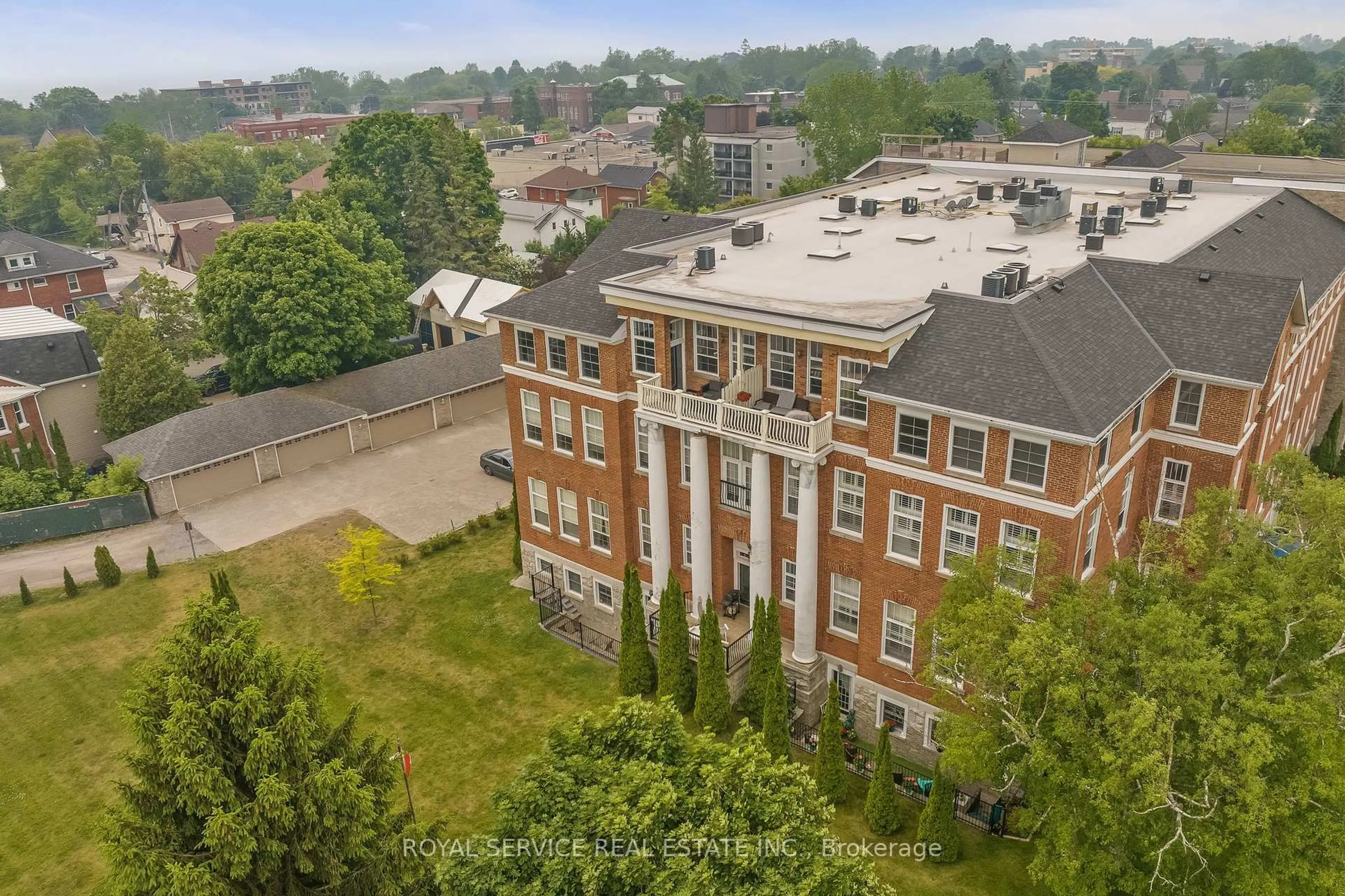 A pic from outside/outdoor area/front of a property/back of a property/a pic from drone, building for 323 George St #403, Cobourg Ontario K9A 3L9