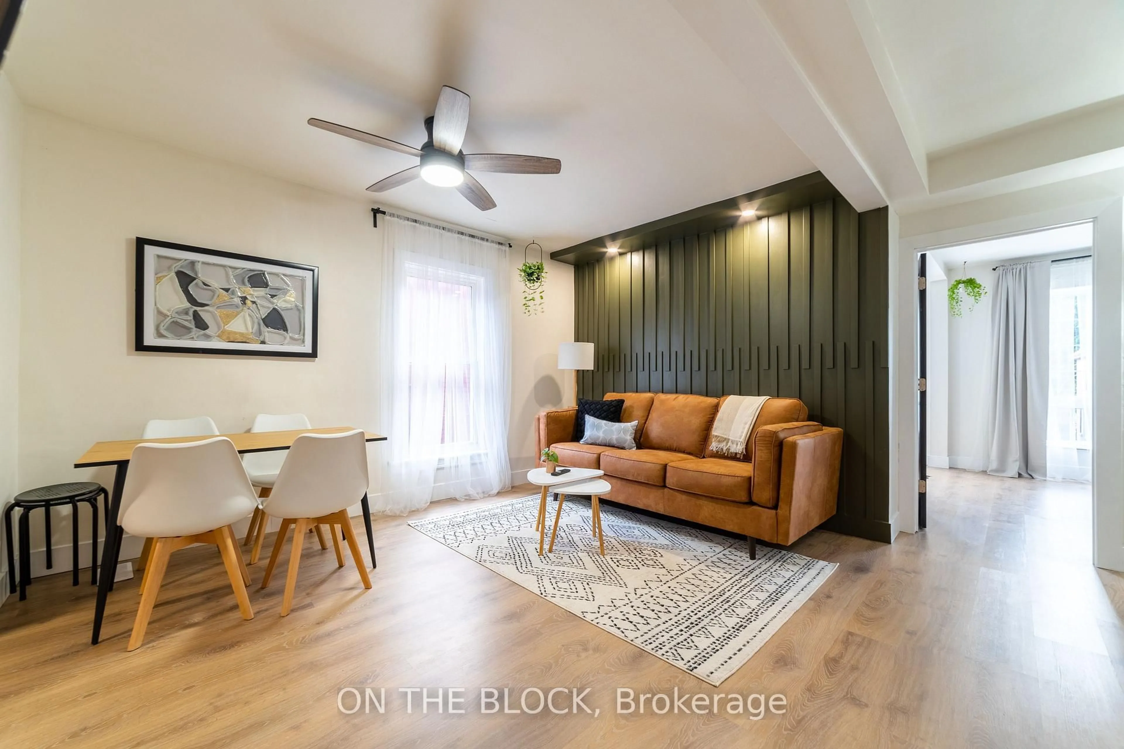 Living room with furniture, wood/laminate floor for 19 Century St, Hamilton Ontario L8L 1V7