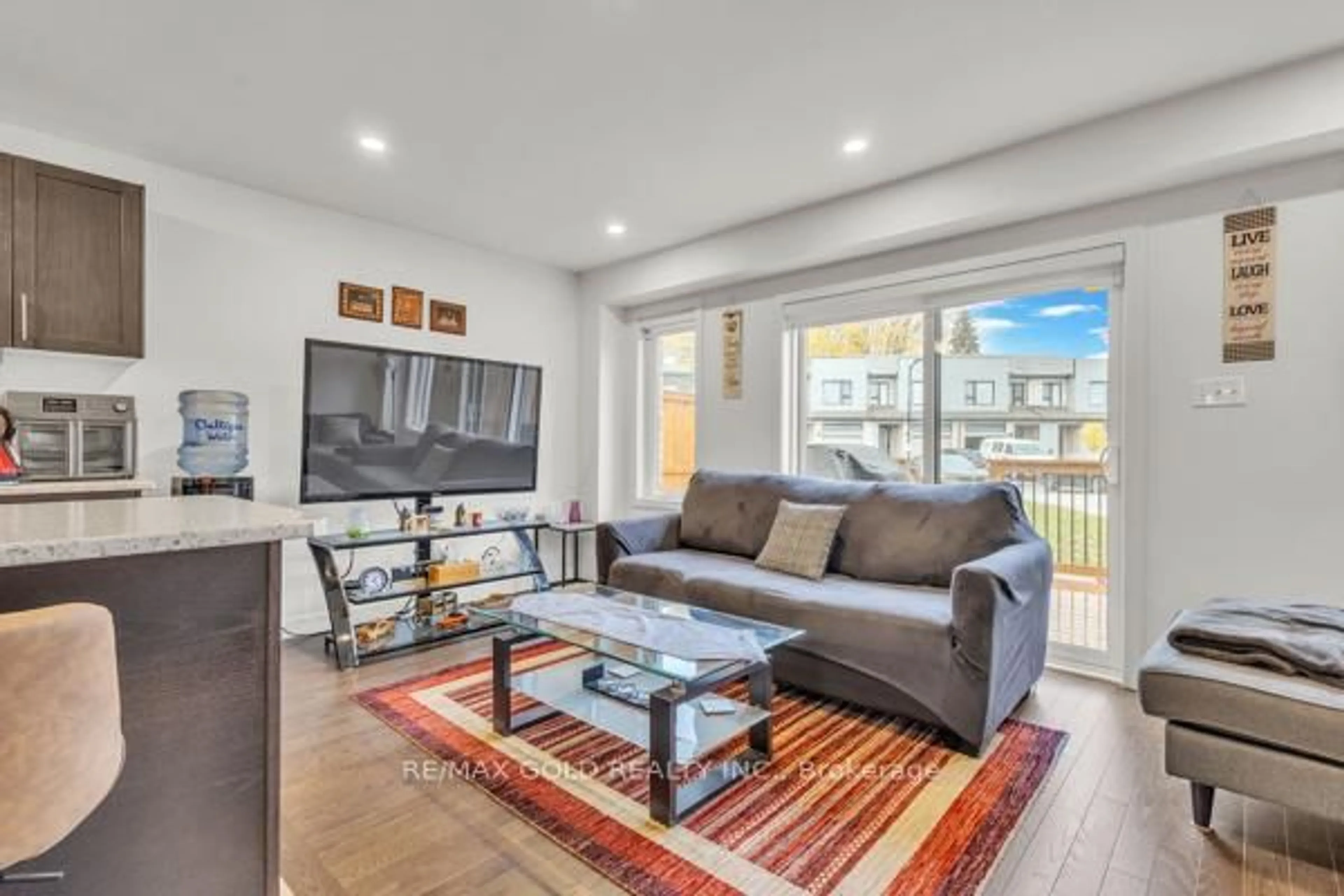 Living room with furniture, wood/laminate floor for 75 Pony Way, Kitchener Ontario N2R 0R8